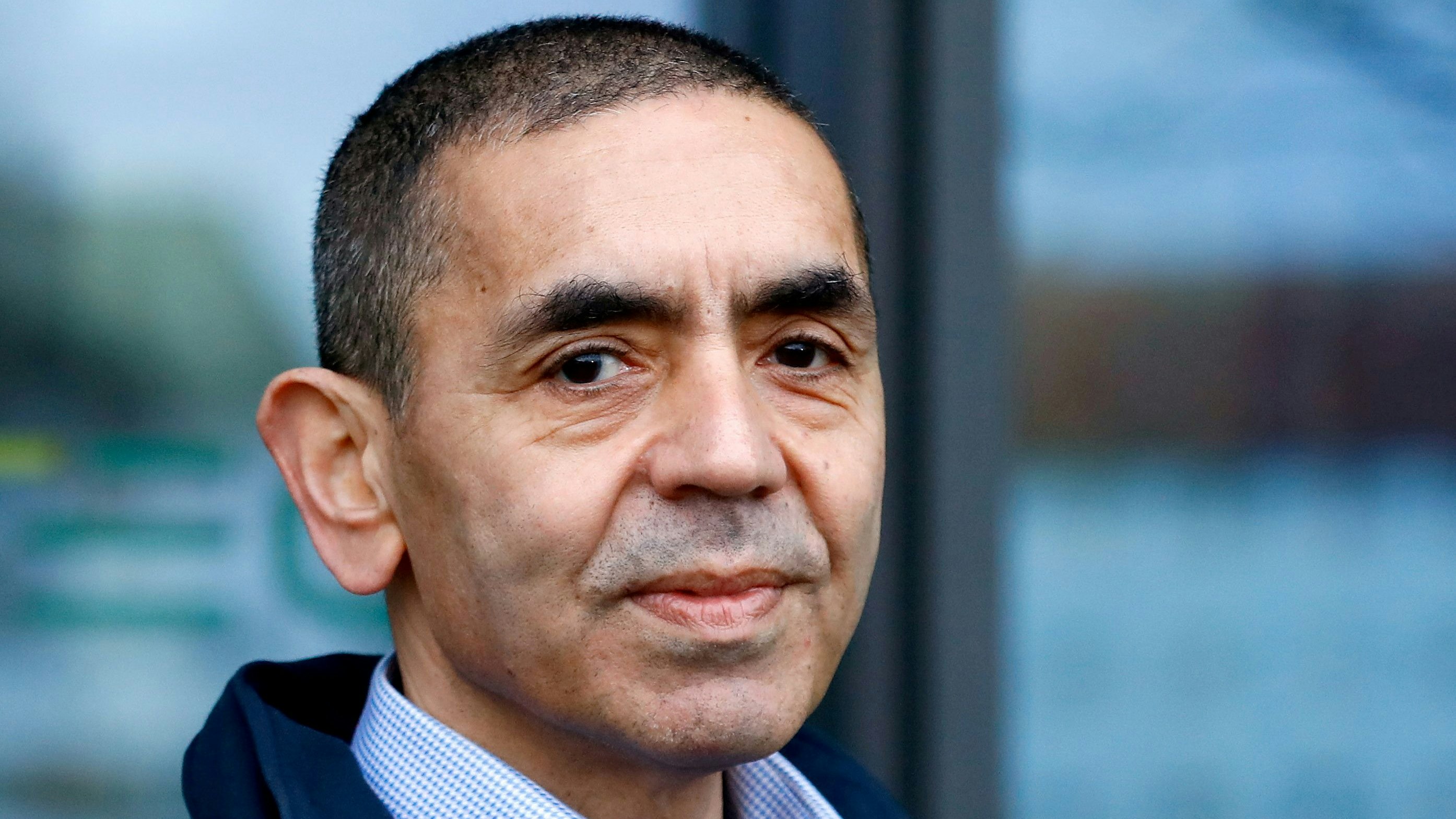 FILE PHOTO: CEO and co-founder of BioNTech, Ugur Sahin, answers journalists' questions after the European Medicines Agency (EMA) approved its COVID-19 vaccine, at the company headquarters in Mainz, Germany December 22, 2020. REUTERS/Ralph Orlowski/File Photo