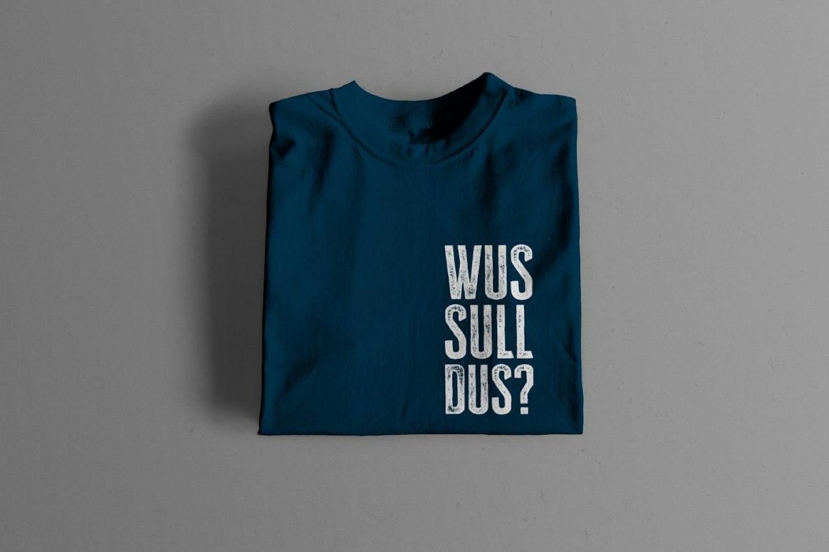 Die T-Shirts mit dem Spruch "Wus sull dus?" sind bis Jänner vergriffen. Mit <em>"Heute"</em> kannst du ein signiertes T-Shirt gewinnen.