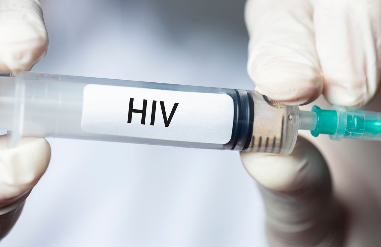 Doctor holding HIV vaccine. HIV vaccine is still in the testing phase.