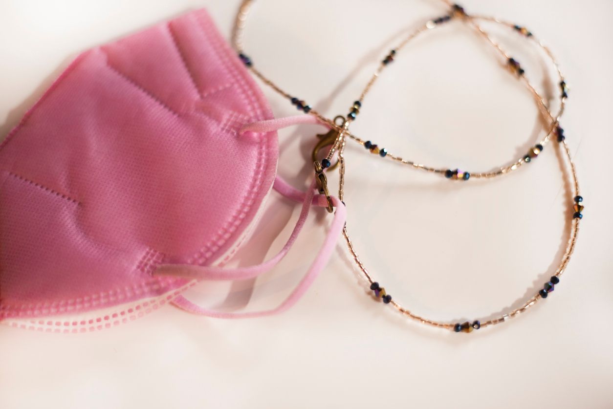 A pink FFP2 protective face mask