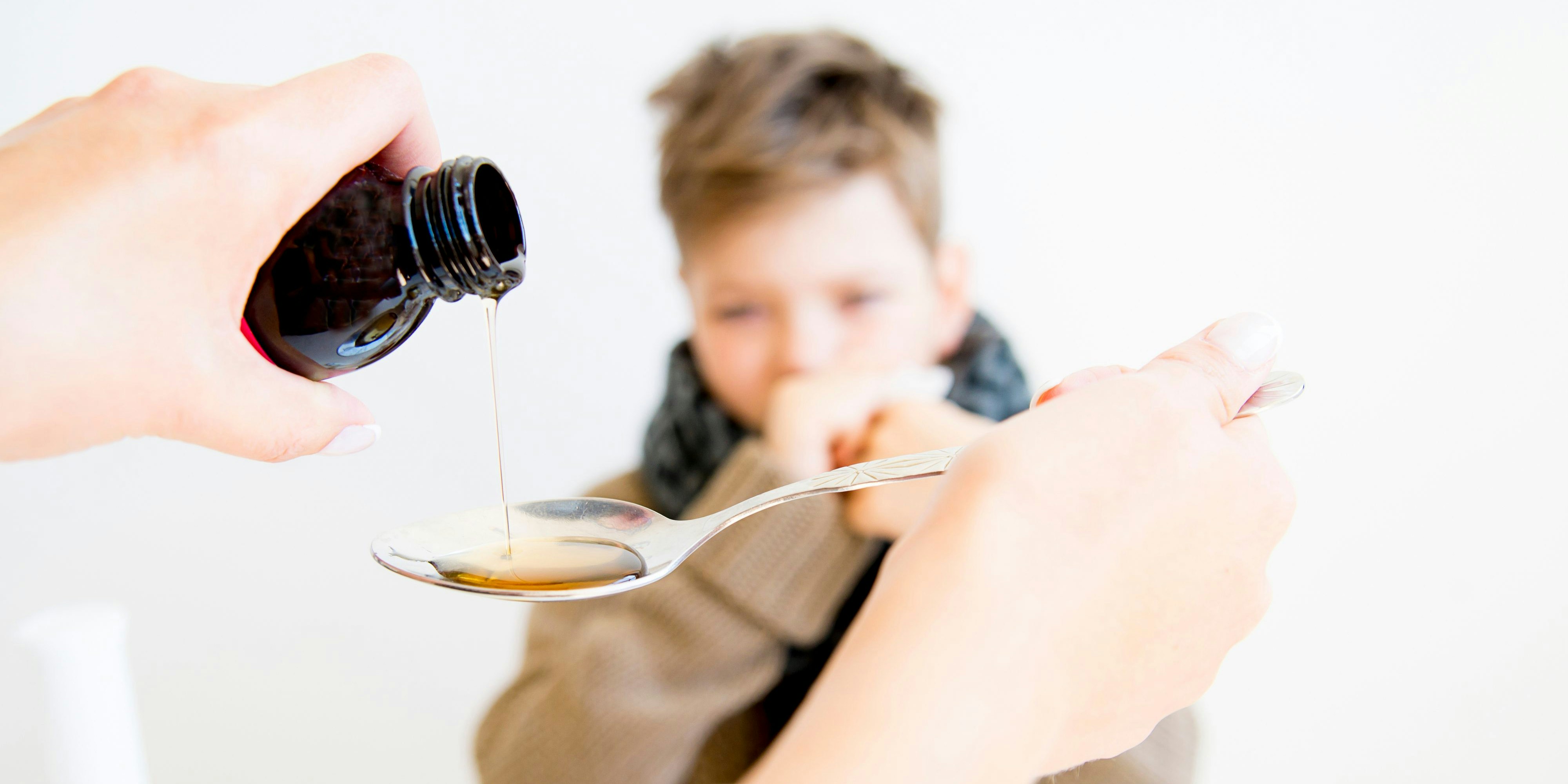 A portrait of a sick boy having flu