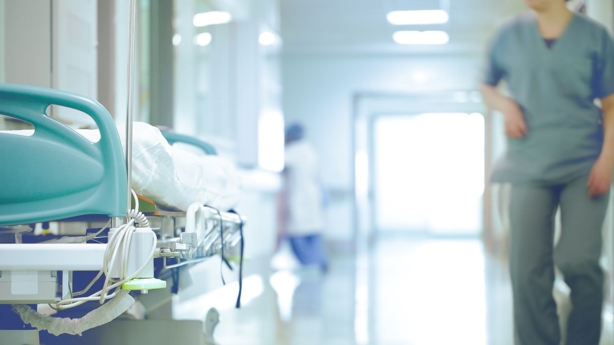 Bed in hallway. The concept of working stressful environment