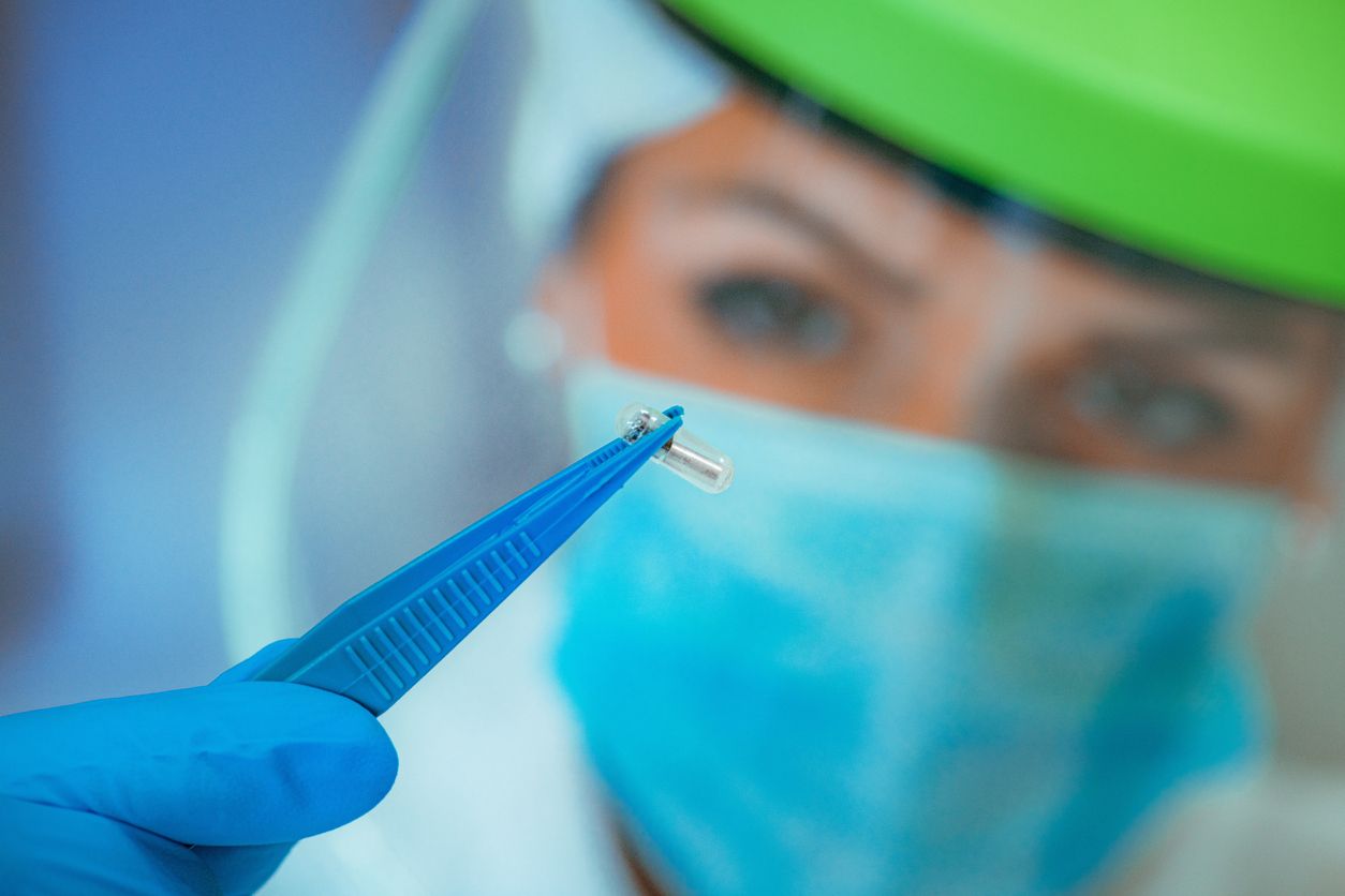 NFC Implant Chip. Scientist Examining New Implant Chip