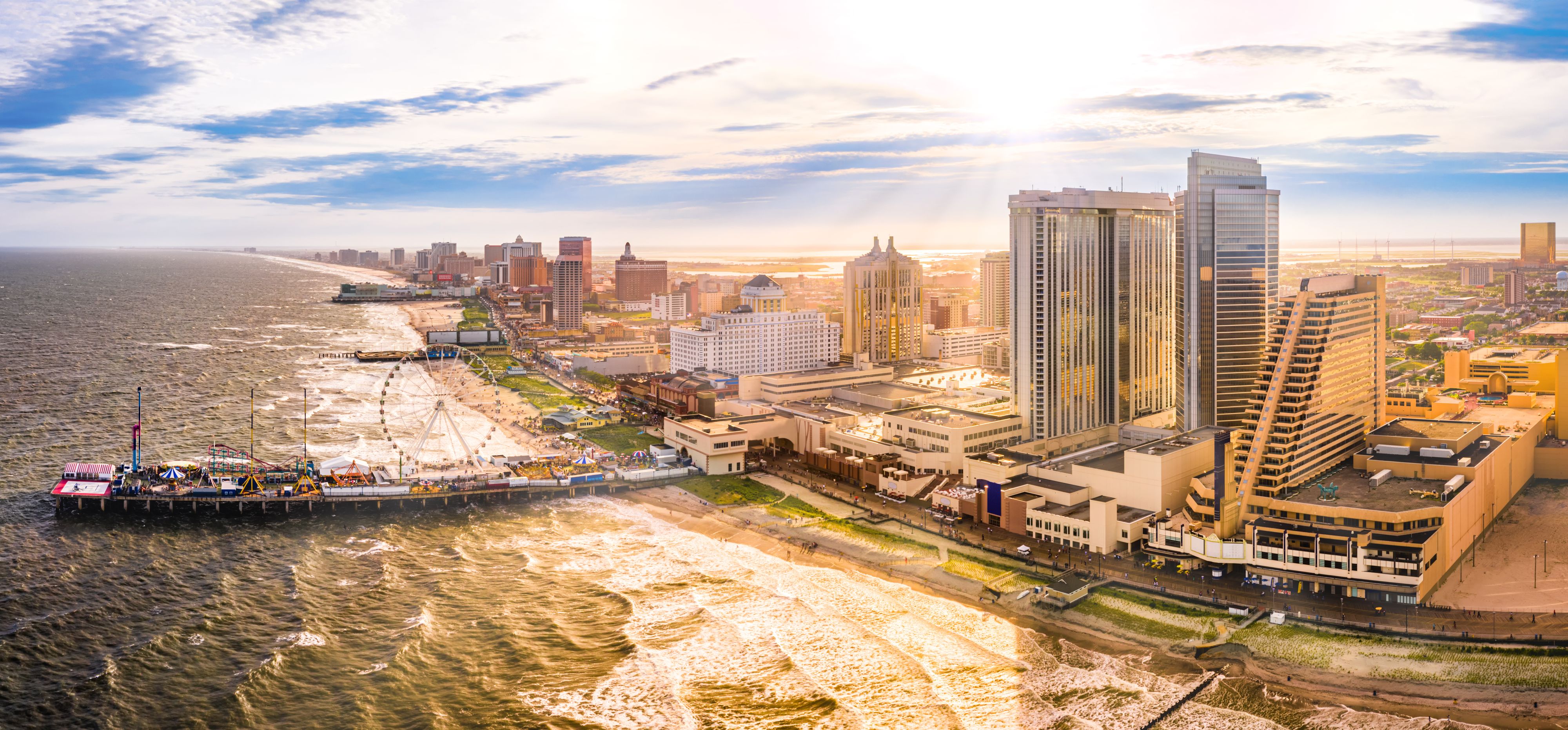 Late afternoon aerial panorama of Atlantic city along the boardwalk. Atlantic City achieved nationwide attention as a gambling resort and currently has nine large casinos.