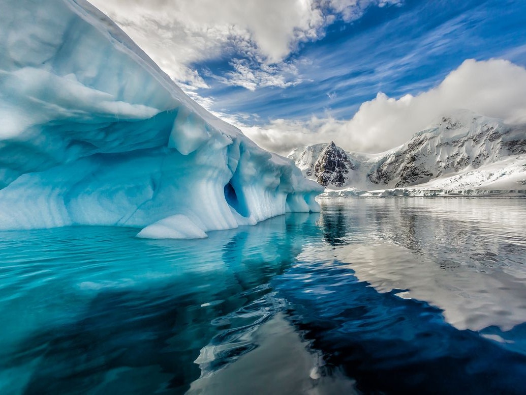 /Iceberg floats in Andord Bay on Graham Land, Antarctic in November