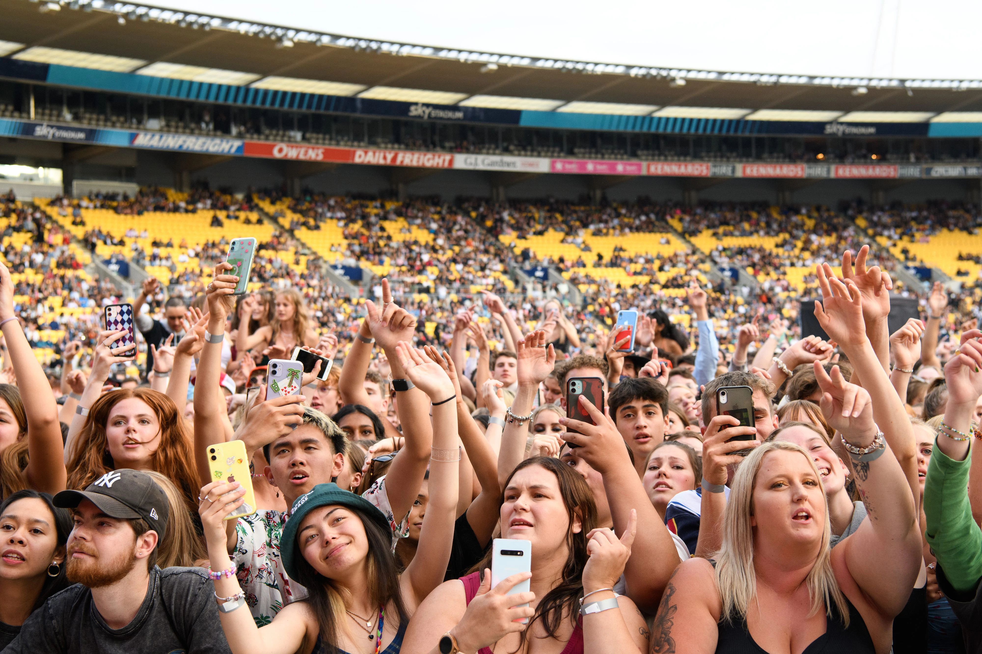 WELLINGTON, NEW ZEALAND - FEBRUARY 13: Fans listen to the Drax Project at Sky Stadium on February 13, 2021 in Wellington, New Zealand. Around 30,000 fans attended the Six60 Saturdays event. The Six60 Saturdays concert series around New Zealand are the largest outdoor concerts music fans have been able to attend since the start of the COVID-19 pandemic. (Photo by Mark Tantrum/Getty Images)