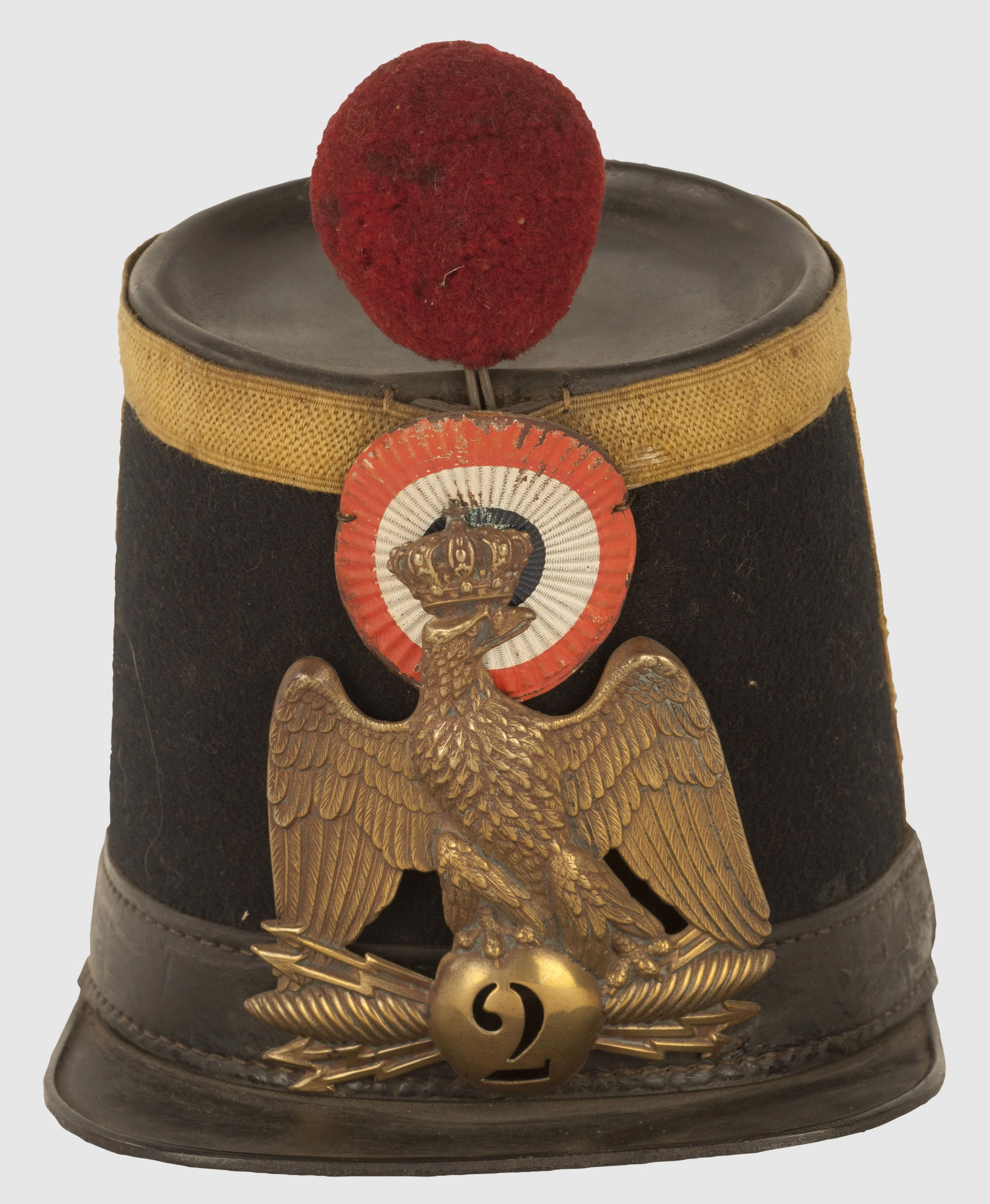 Hier sieht man einen Tschako des Voltigeurs des 2. Linieninfanterieregiments aus 1856 - nicht zu übersehen? Der Bommel! <br>