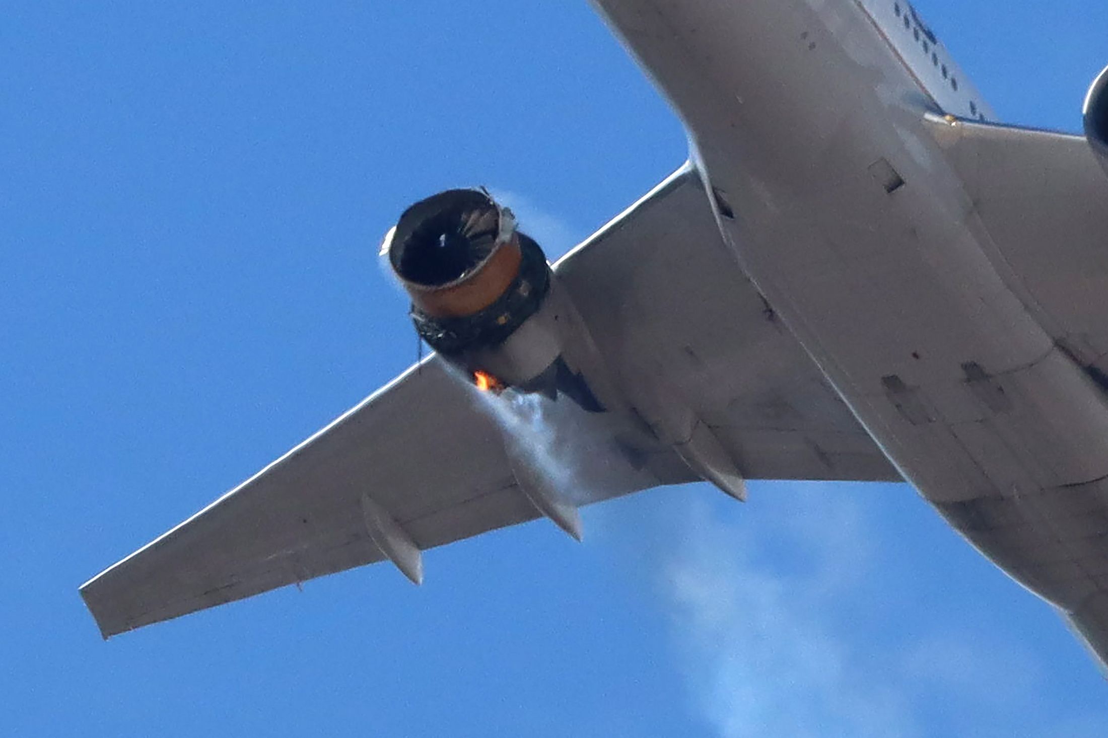 United Airlines flight UA328, carrying 231 passengers and 10 crew on board, returns to Denver International Airport with its starboard engine on fire after it called a Mayday alert, over Denver, Colorado, U.S. February 20, 2021.    Hayden Smith/@speedbird5280/Handout via REUTERS.  NO RESALES. NO ARCHIVES. MANDATORY CREDIT. THIS IMAGE HAS BEEN SUPPLIED BY A THIRD PARTY.