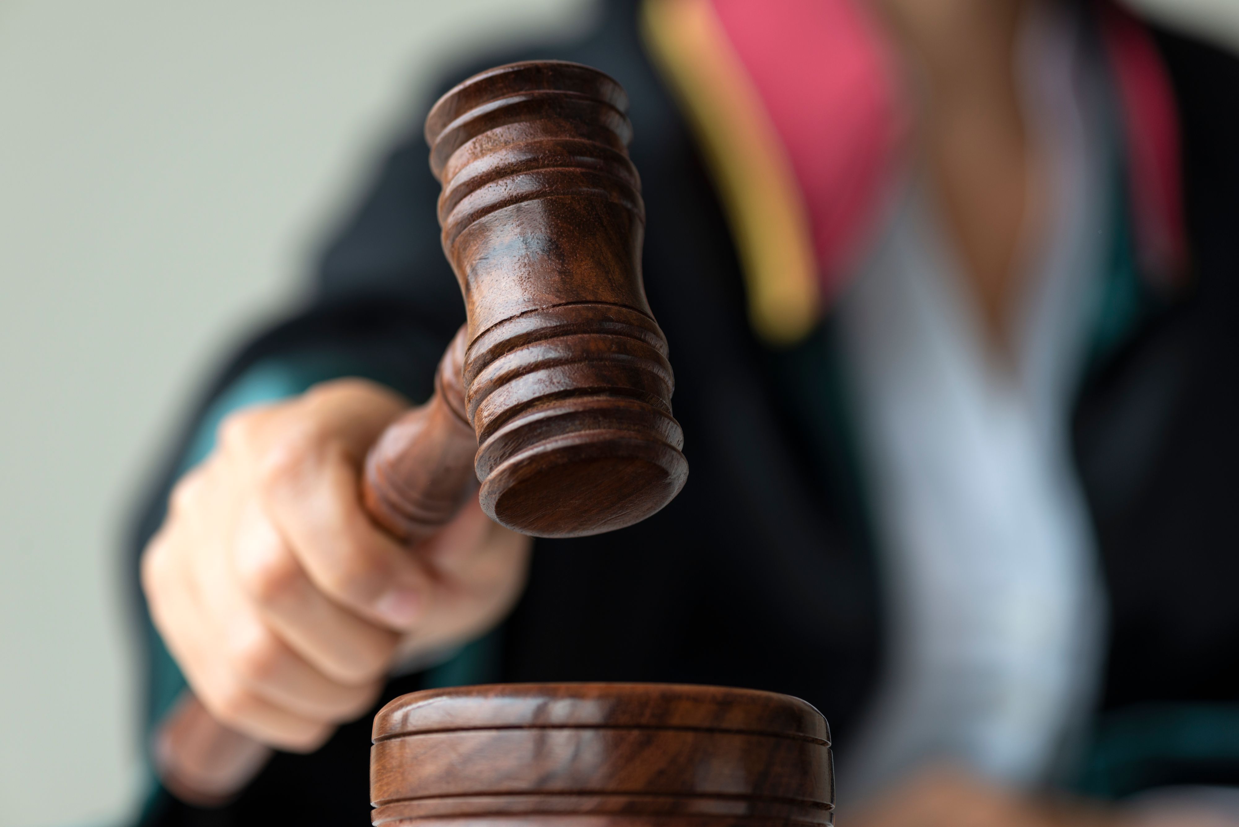 Woman holding gavel.