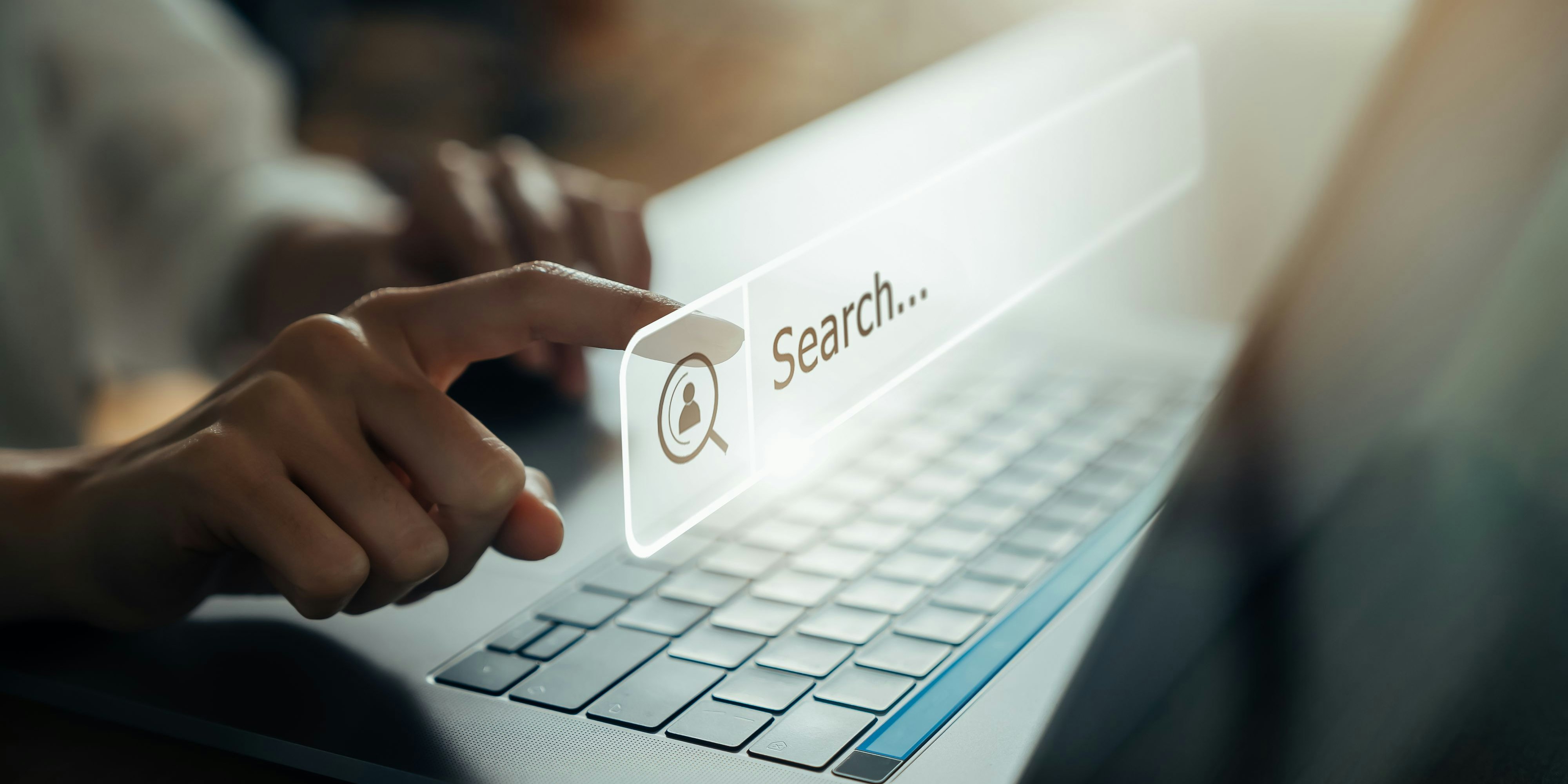 Hand using laptop and press screen to search Browsing on the Internet online.