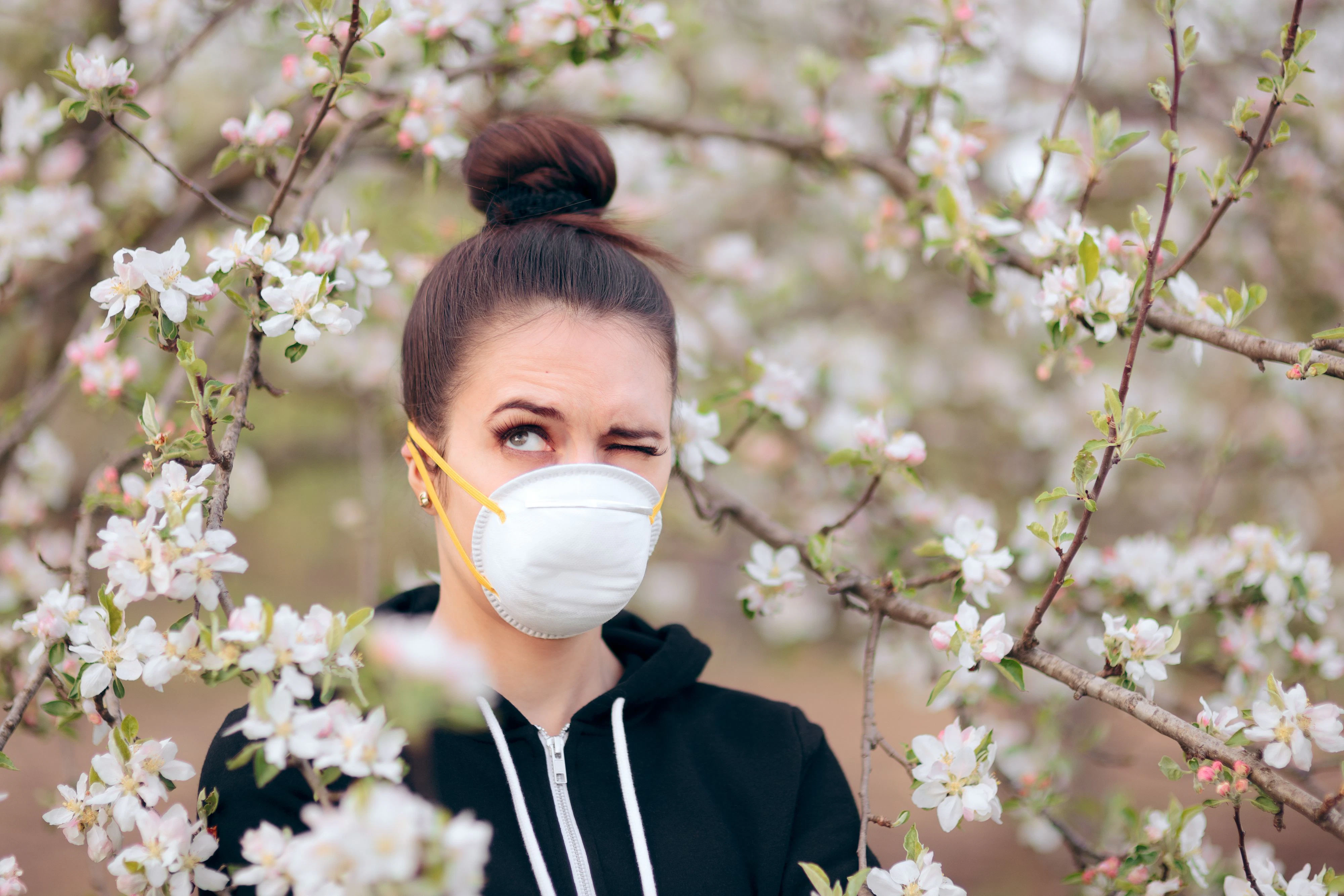 Funny girl trying to protect herself from pollen and allergens