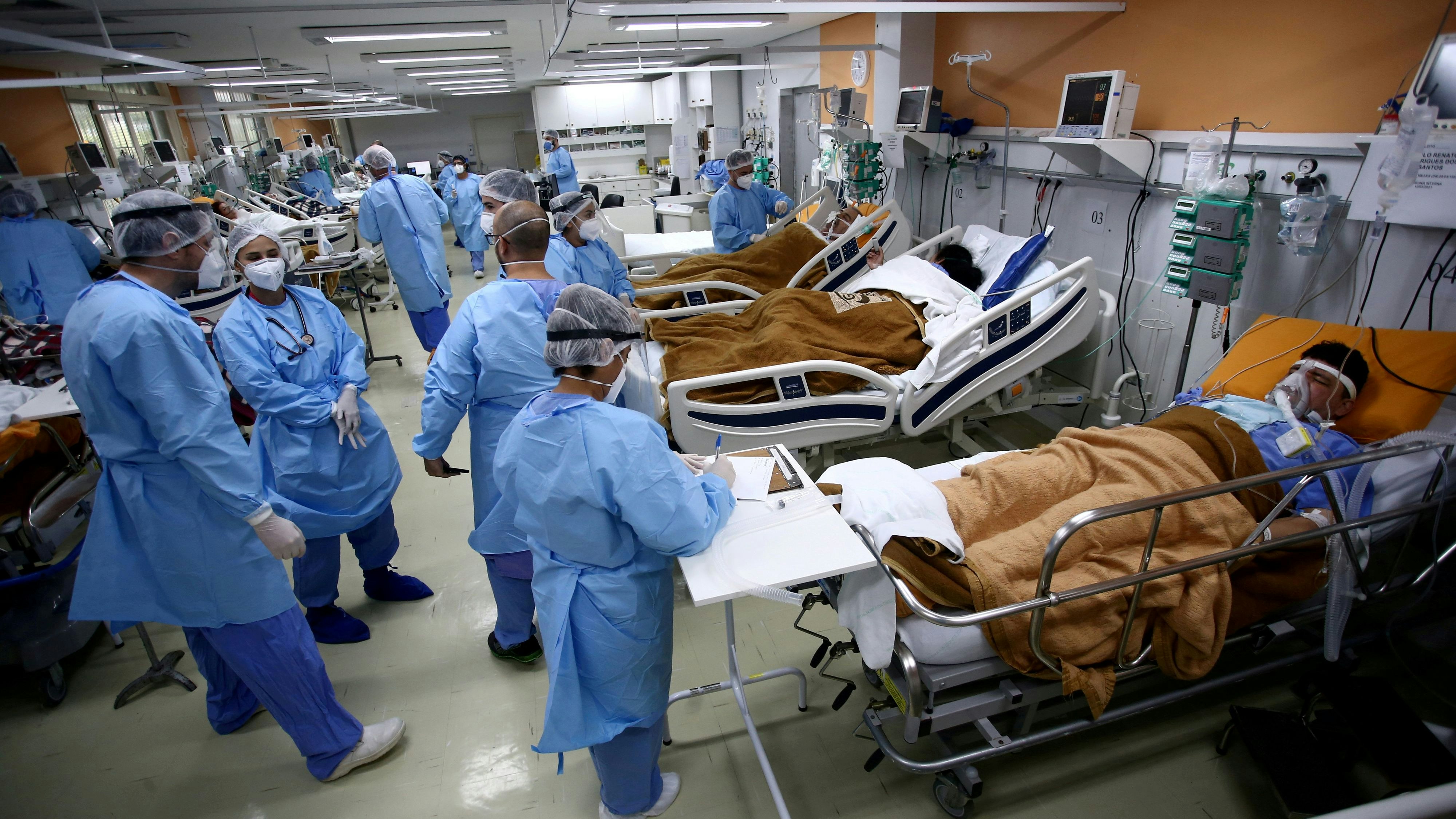 FILE PHOTO: Medical workers take care of patients in the emergency room of the Nossa Senhora da Conceicao hospital that is overcrowding because of the coronavirus outbreak, in Porto Alegre, Brazil, March 11, 2021.  REUTERS/Diego Vara/File Photo