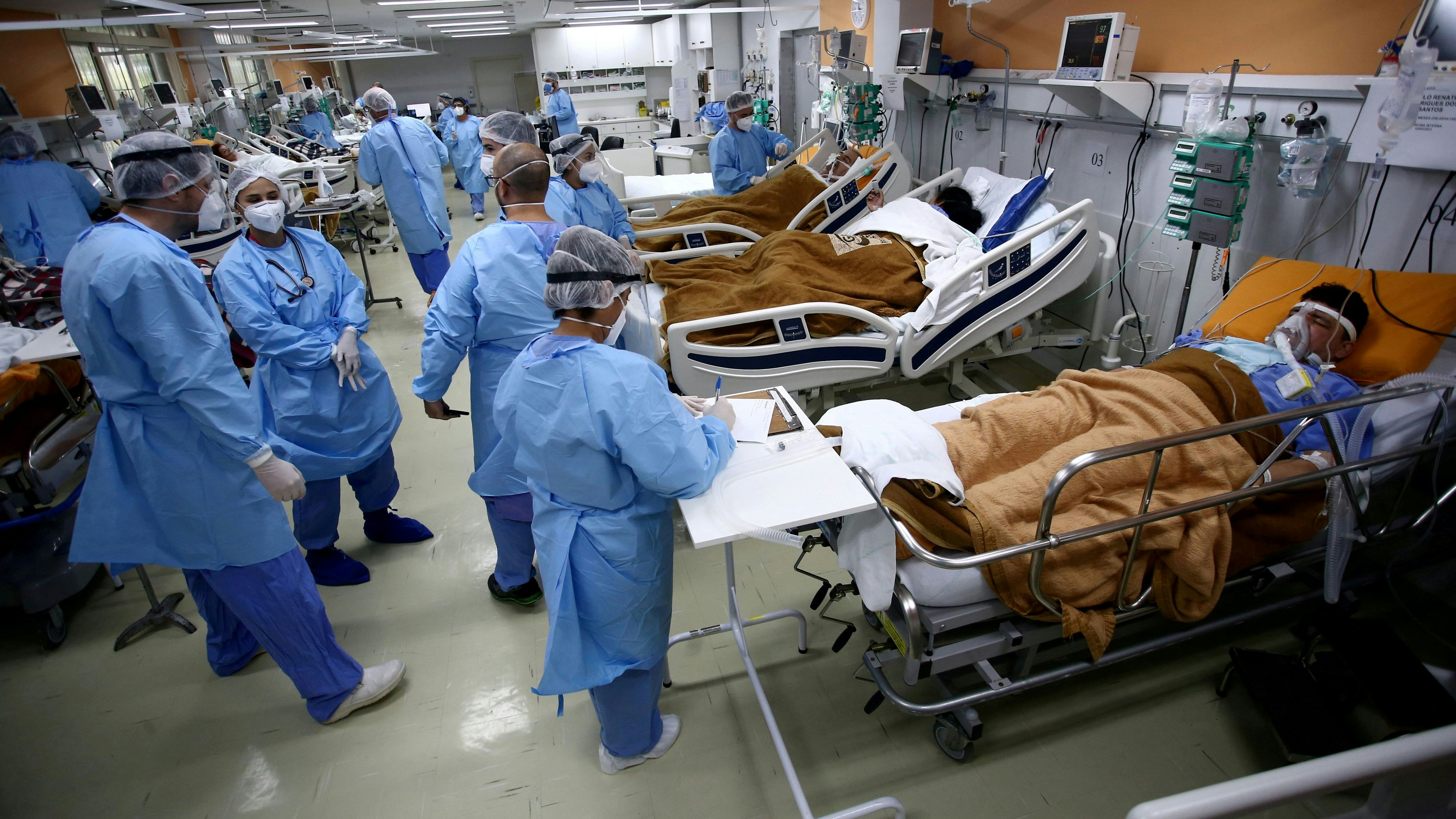 FILE PHOTO: Medical workers take care of patients in the emergency room of the Nossa Senhora da Conceicao hospital that is overcrowding because of the coronavirus outbreak, in Porto Alegre, Brazil, March 11, 2021.  REUTERS/Diego Vara/File Photo