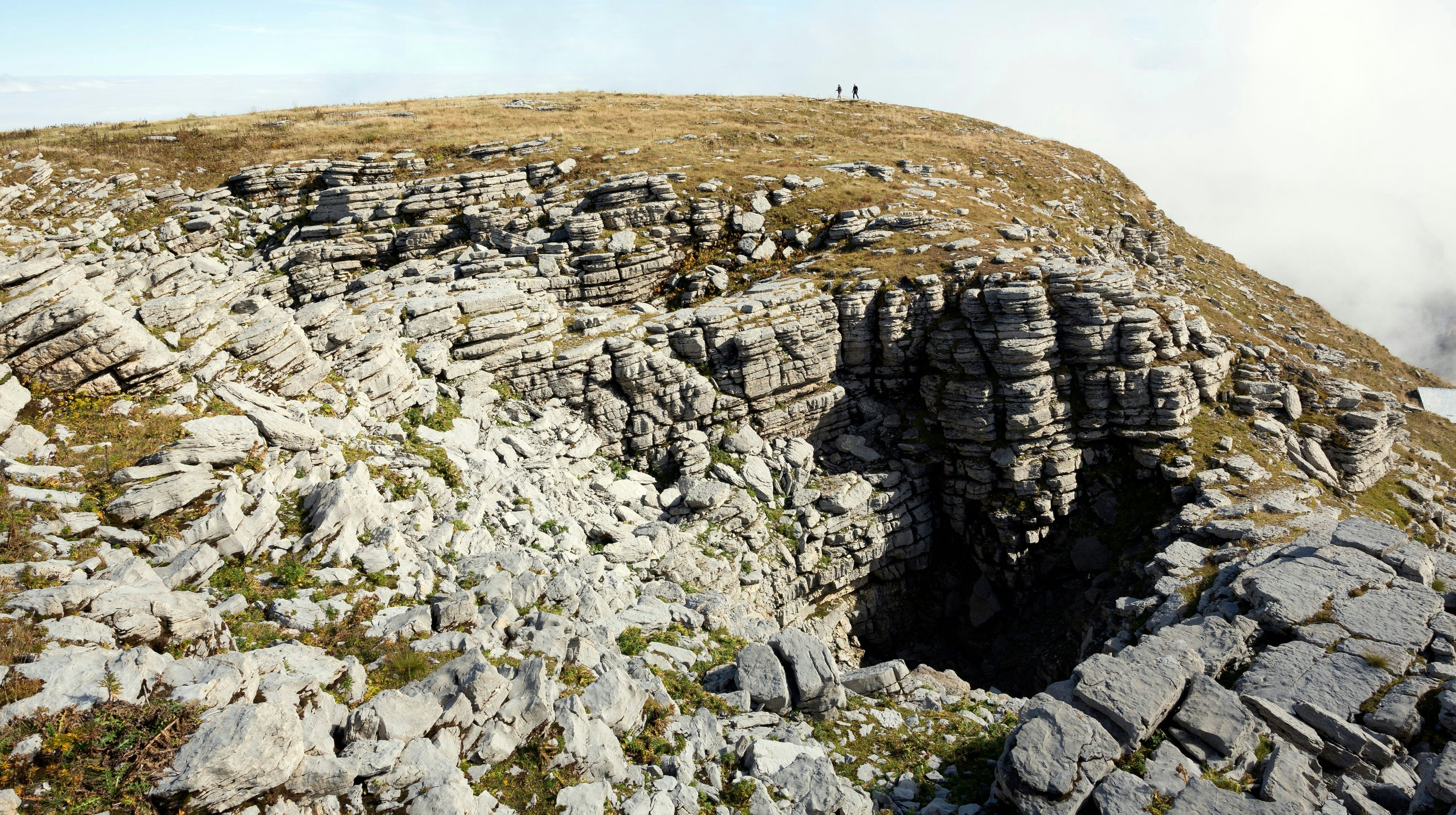 Download von www.picturedesk.com am 25.04.2021 (10:23).  A prominent doline has formed in the summit plateau of Hinderrugg, one of the Churfirsten mountains in north-eastern Switzerland. Dolines are a result of chemical weathering, involving rainwater, of limestone. - 20151231_PD7820 - Rechteinfo: Rights Managed (RM)