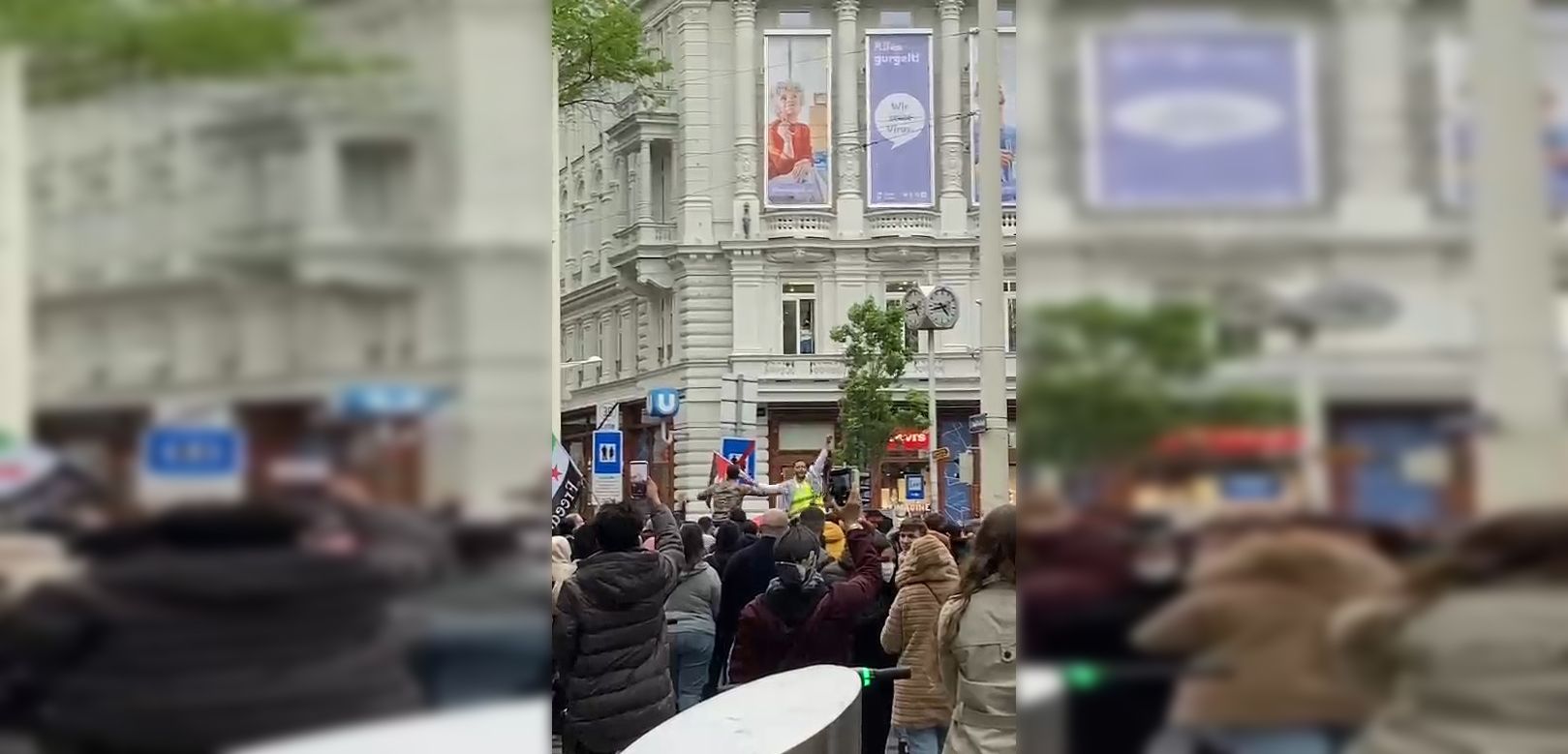 Trotz strömenden Regens demonstrieren die Menschen auf der MaHü. 