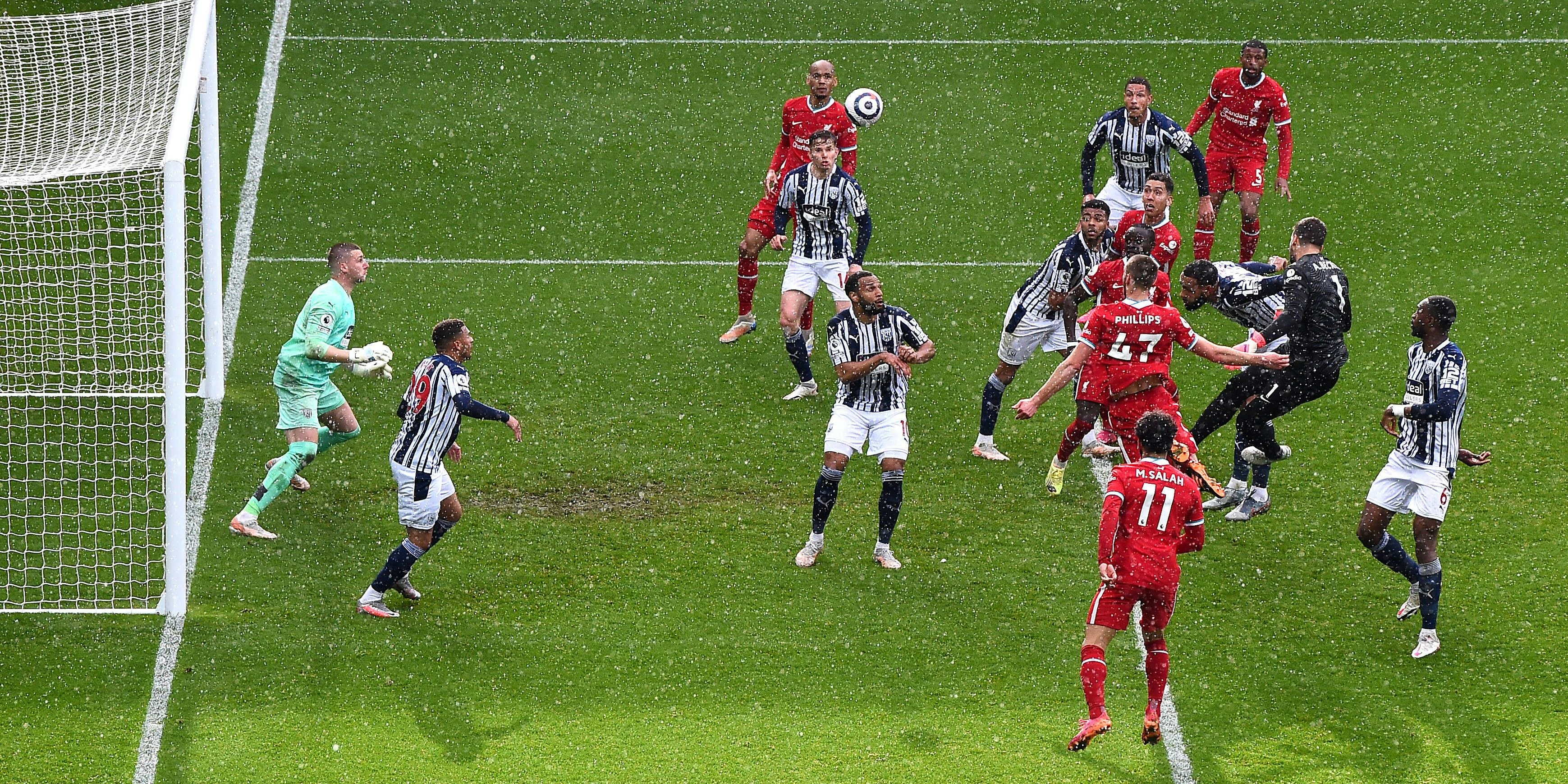 West Bromwich Albion v Liverpool - Premier League - The Hawthorns Liverpool goalkeeper Alisson second right scores their side s second goal of the game during the Premier League match at The Hawthorns, West Bromwich. Picture date: Sunday May 16, 2021. EDITORIAL USE ONLY No use with unauthorised audio, video, data, fixture lists, club/league logos or live services. Online in-match use limited to 120 images, no video emulation. No use in betting, games or single club/league/player publications. PUBLICATIONxINxGERxSUIxAUTxONLY Copyright: xLaurencexGriffithsx 59816270 