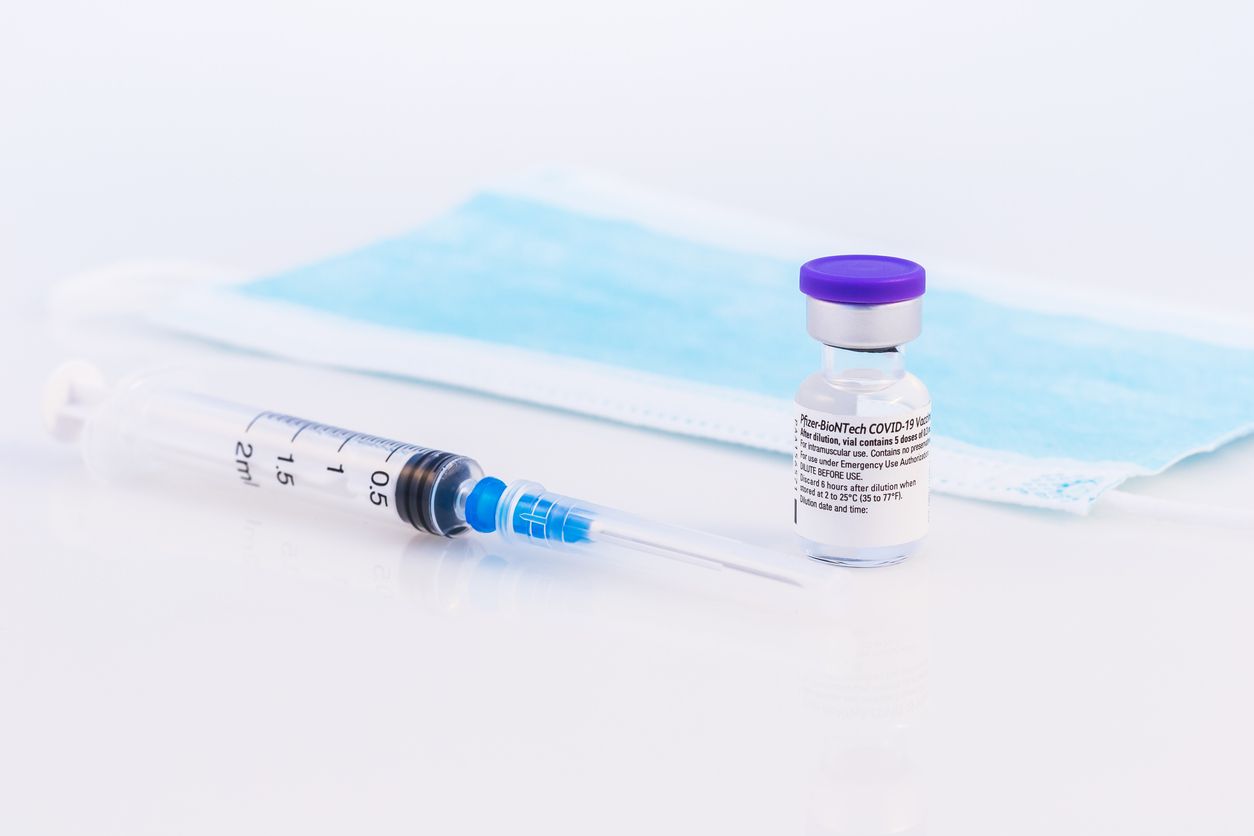 Brasov, Romania - February 21, 2021: Pfizer-BioNTech Covid-19 vaccine on a white background.