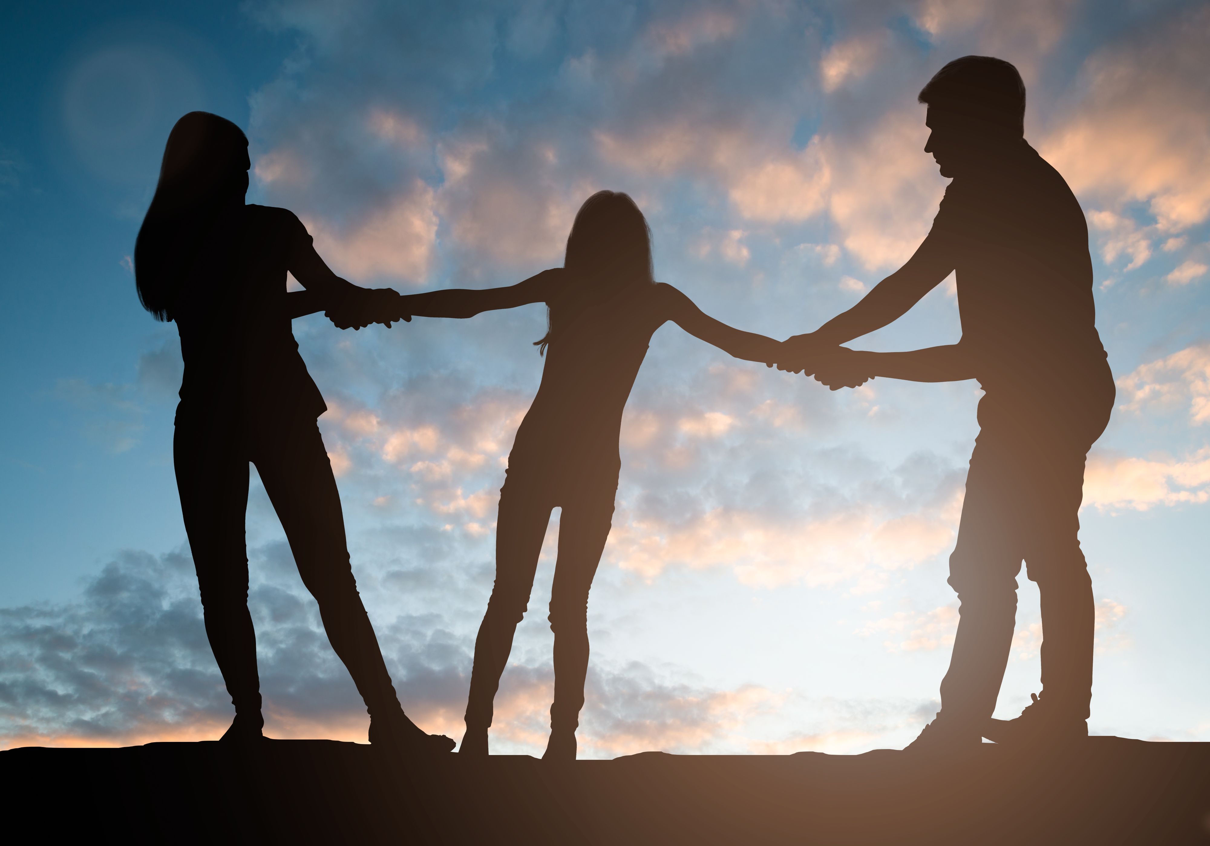 Unhappy Couple Pulling Their Daughter On Their Side On White Background
