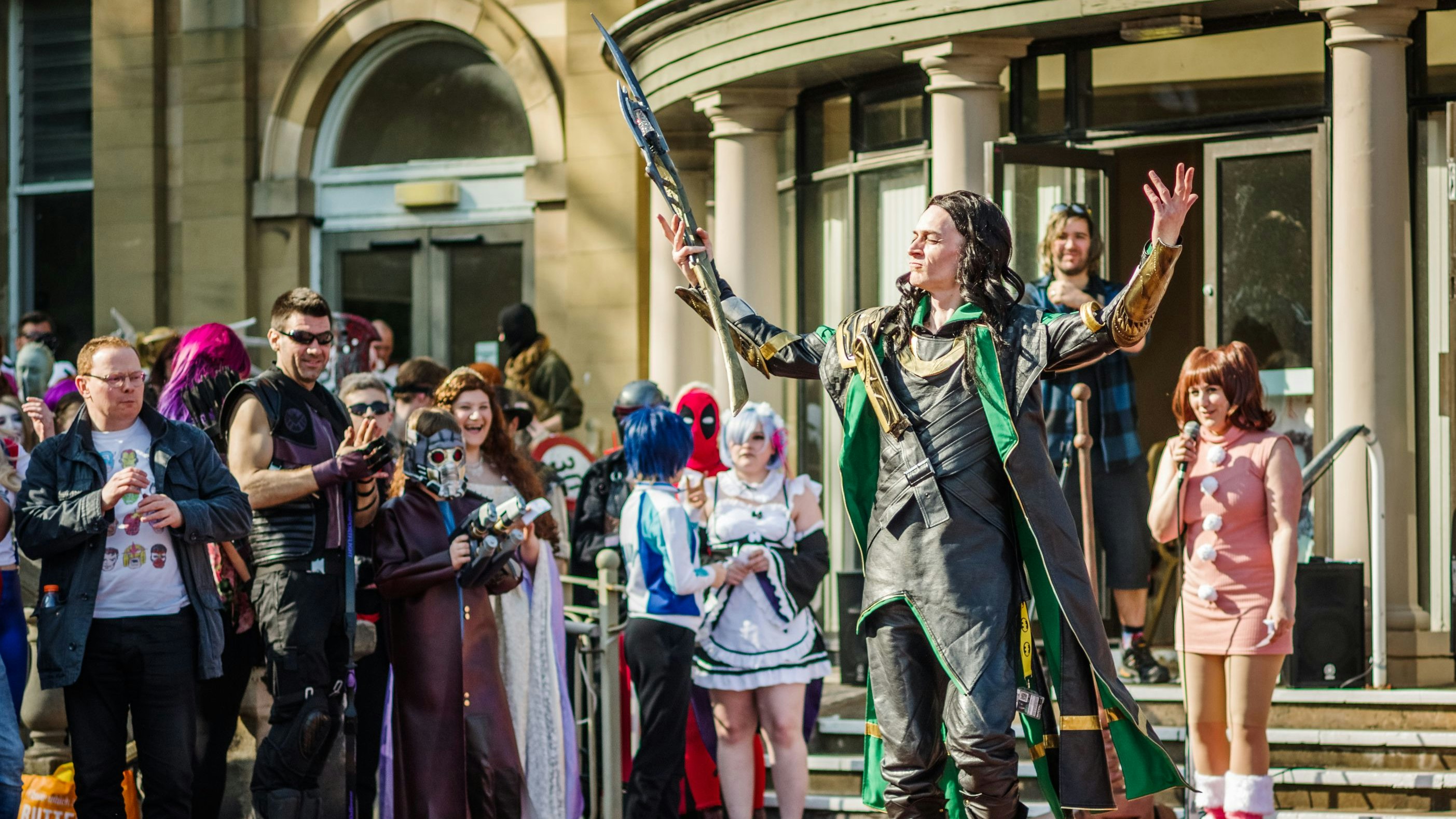 Cosplayer dressed as the Marvel character 'Loki' encourages the crowd during a cosplay competition at Sci-Fi Scarborough.