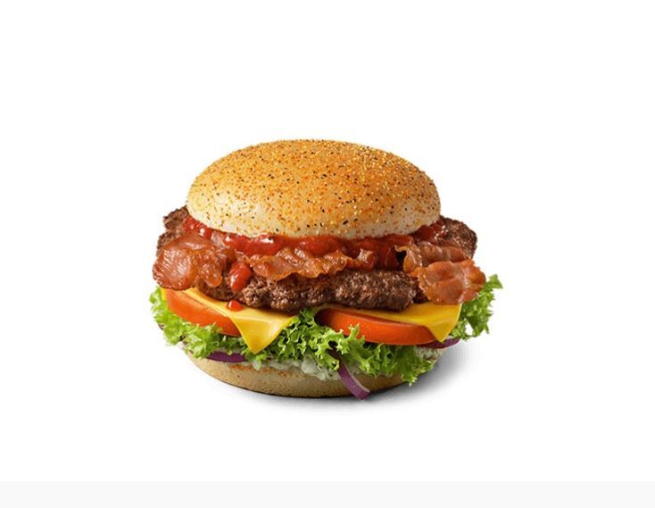 Die Rezeptur: Rindfleisch, Speck, Käse und Kräuterbutter-Sauce. Entsprechend der deutschen Landesflagge ist das Bun schwarz-rot-gold bestreut.