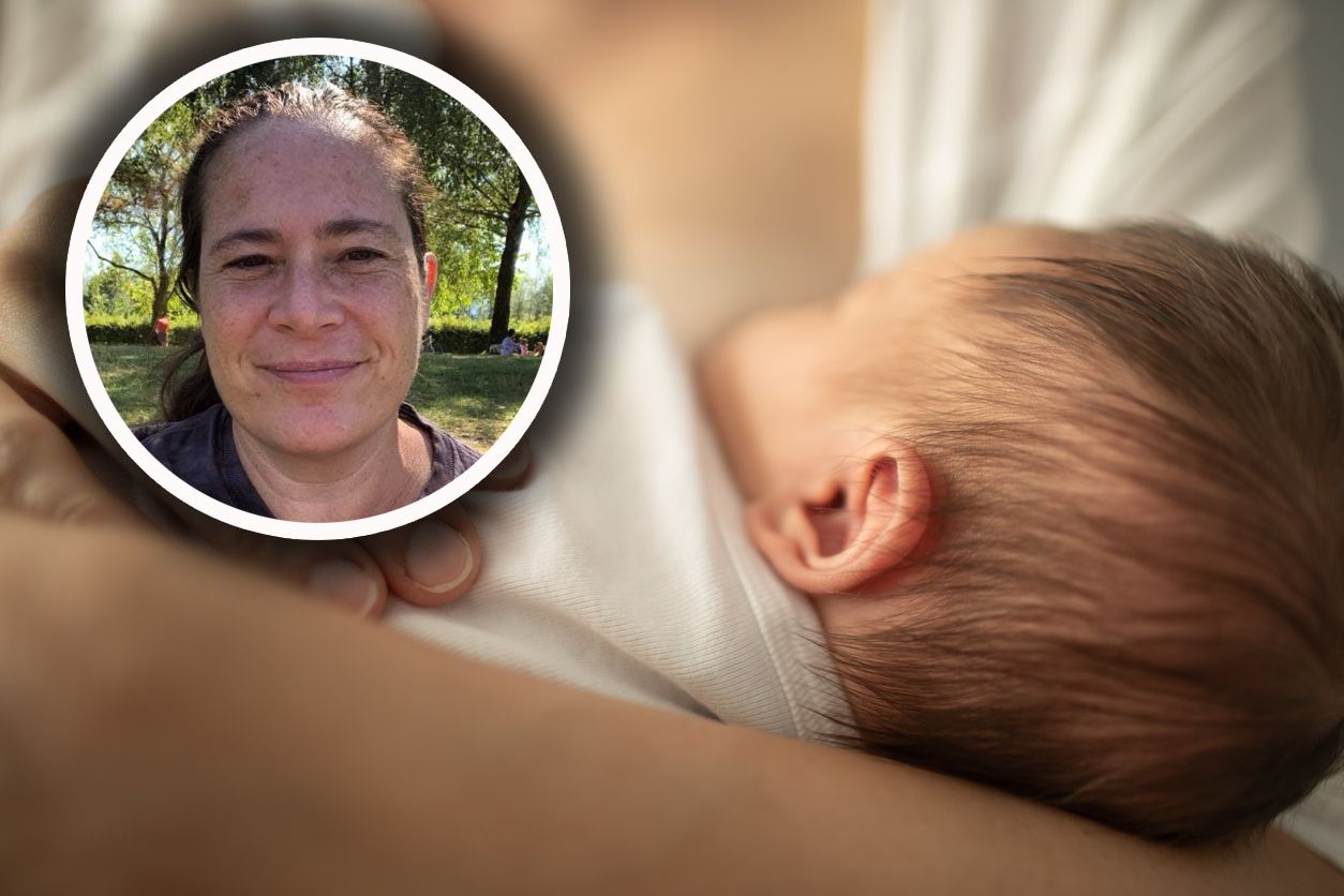 Mother breastfeeding her little baby girl. Breastfeeding and family concept.