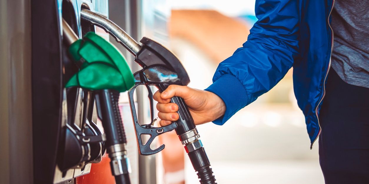 Male hand holding fuel pump nozzle, Diesel Fuel, Car,