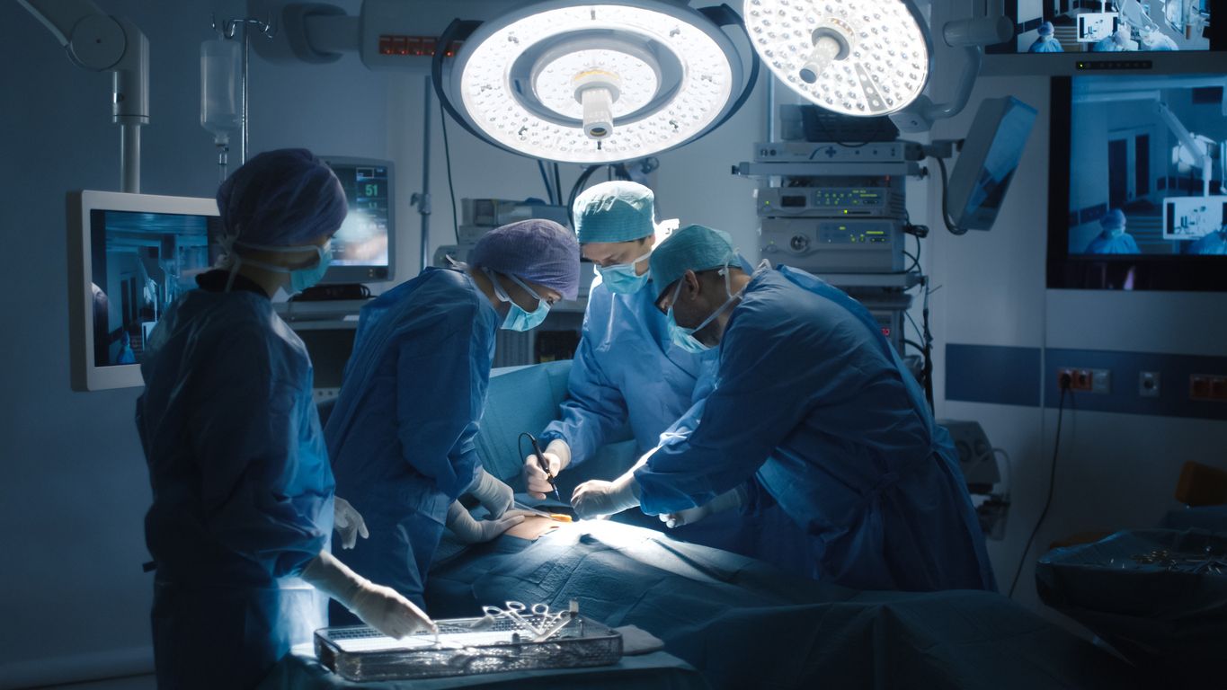 Medical Team Performing Surgical Operation in Modern Operating Room