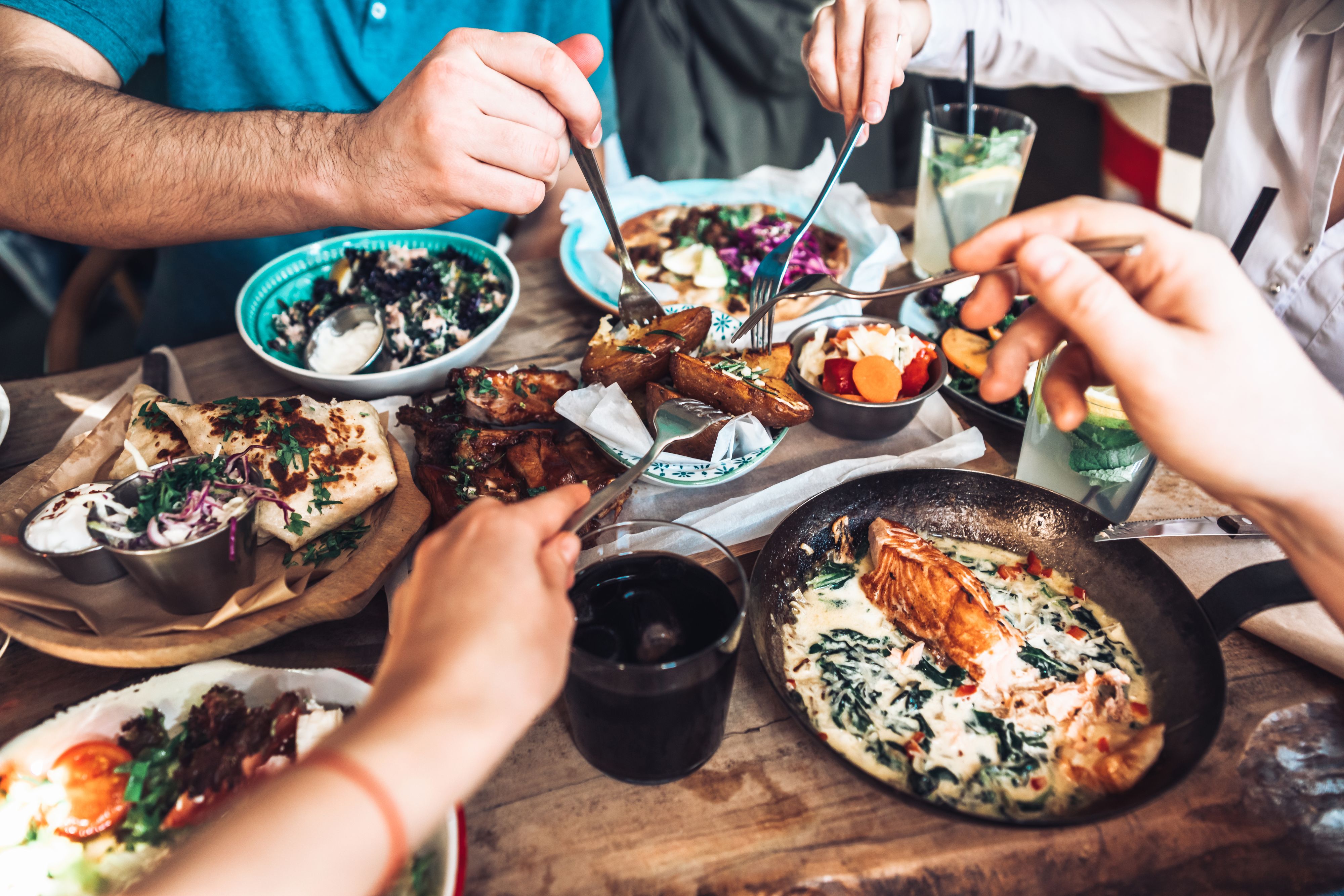 Happy people sharing their healthy lunch