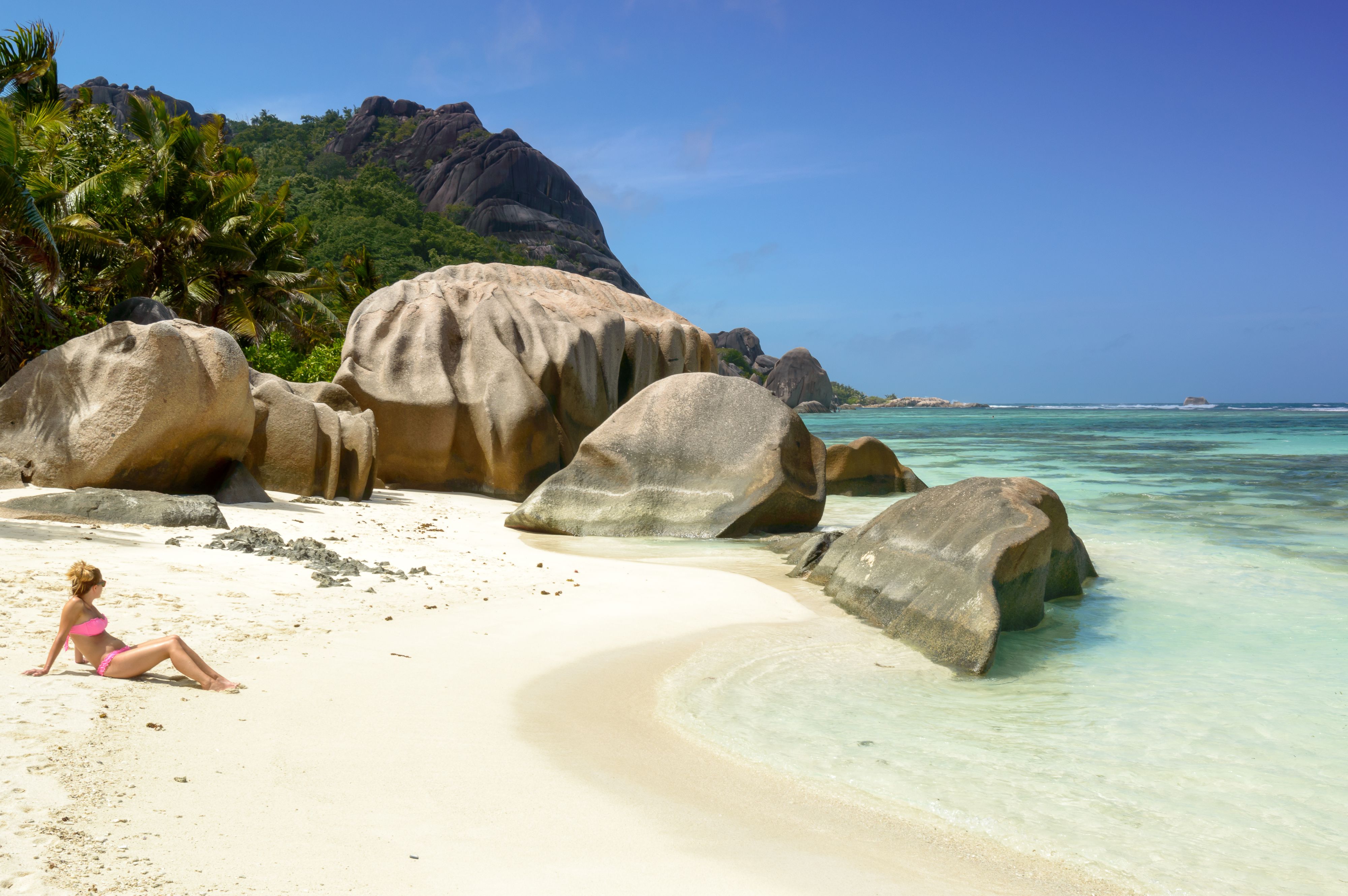 attractive woman in paradise beach of Seychelles,  La Digue Island, Anse Source d'Argent. nature background