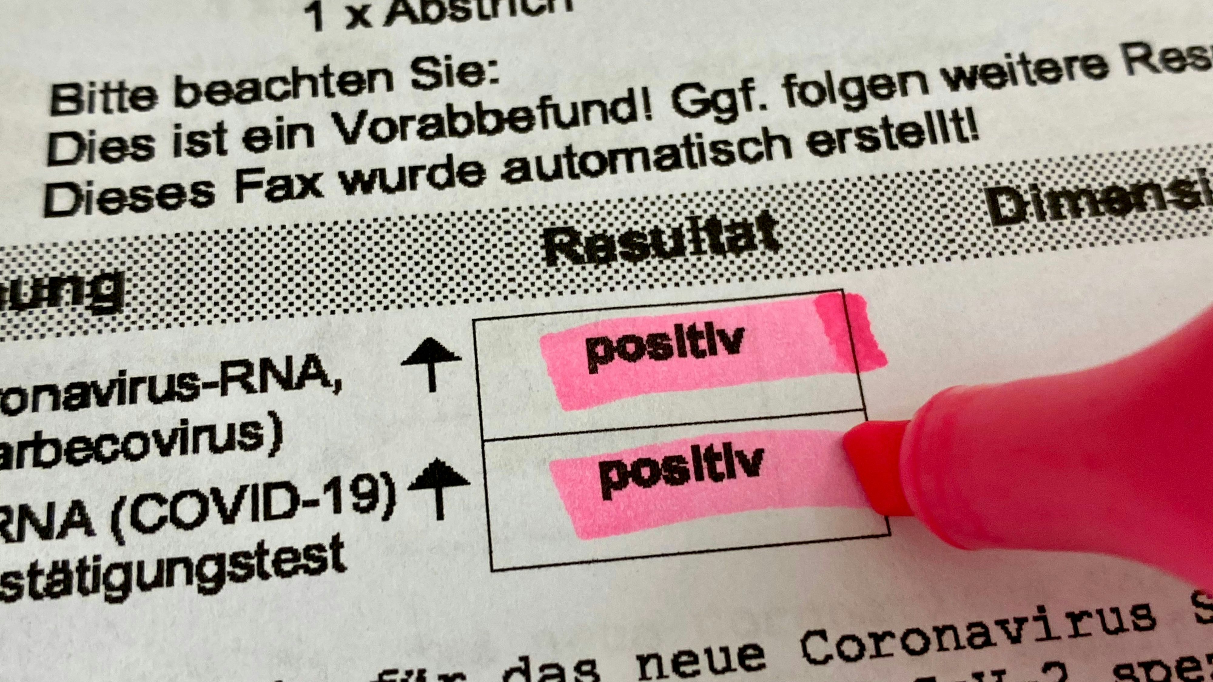 Positive Covid-19 PCR test results highlighted on lab results sheet