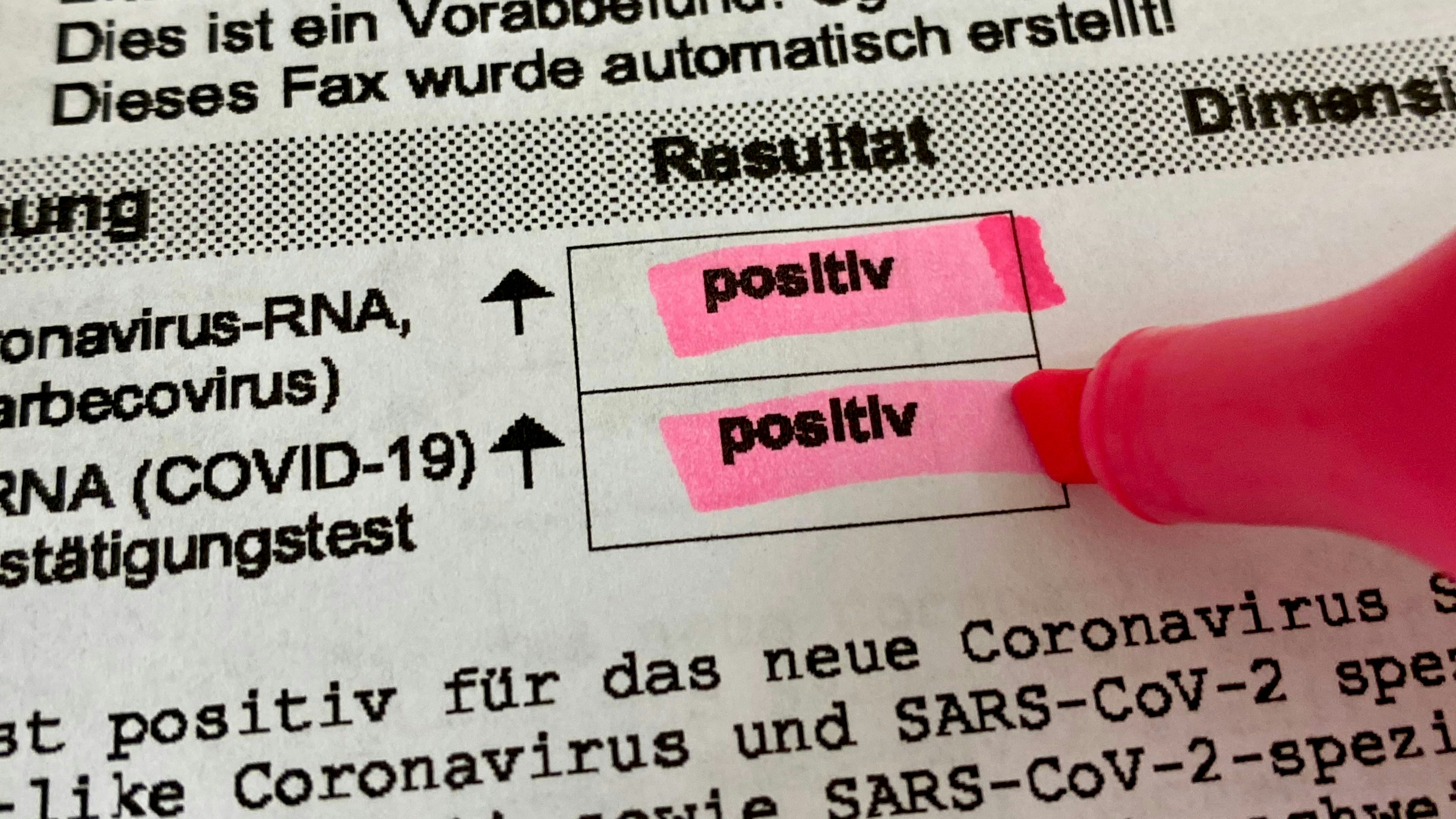 Positive Covid-19 PCR test results highlighted on lab results sheet