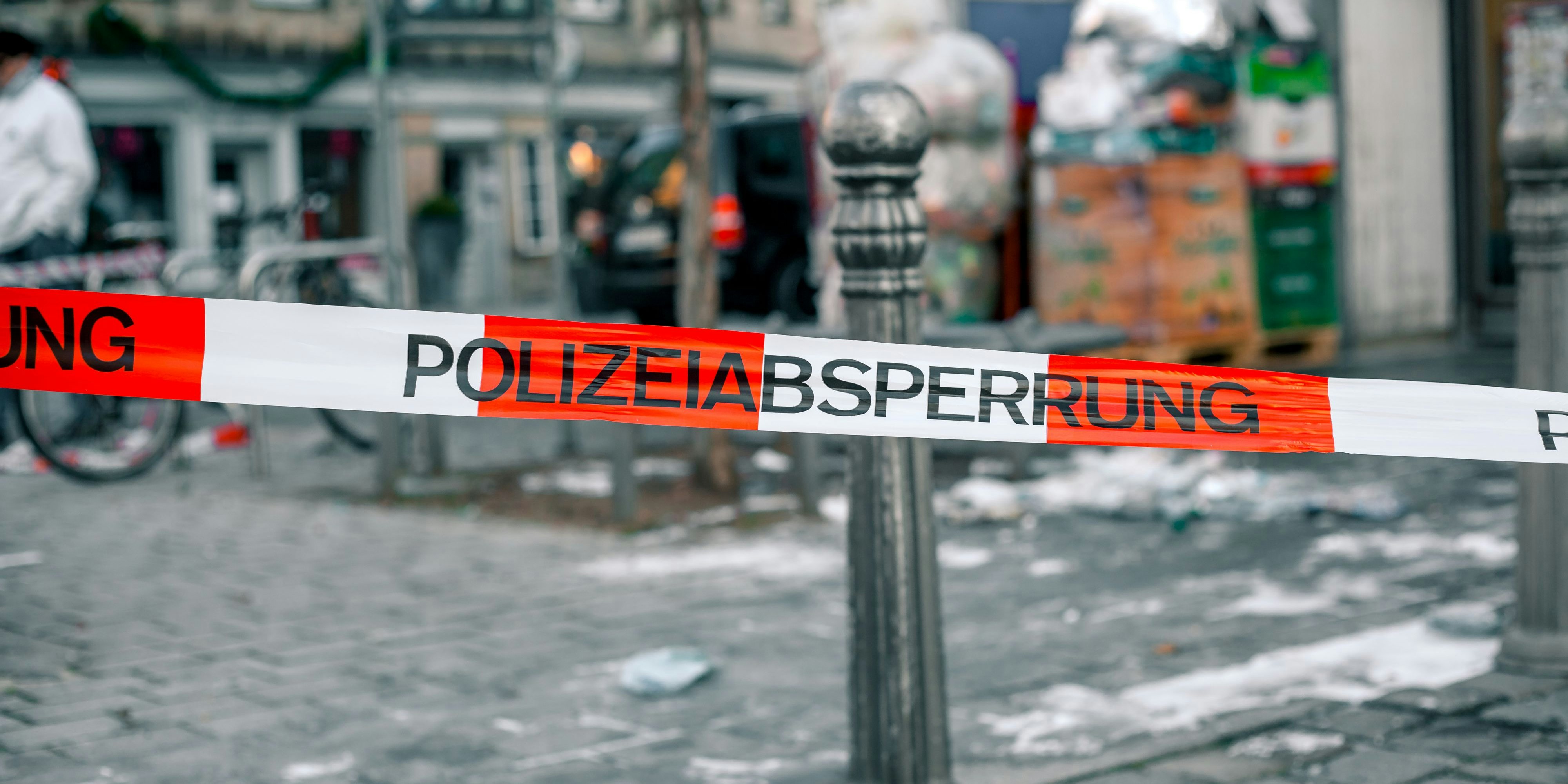 Police tape in Germany at the crime scene with the inscription in German police cordon. Crime Scene Investigation.