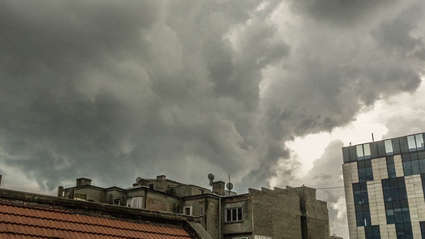 Summer storm approaching a city