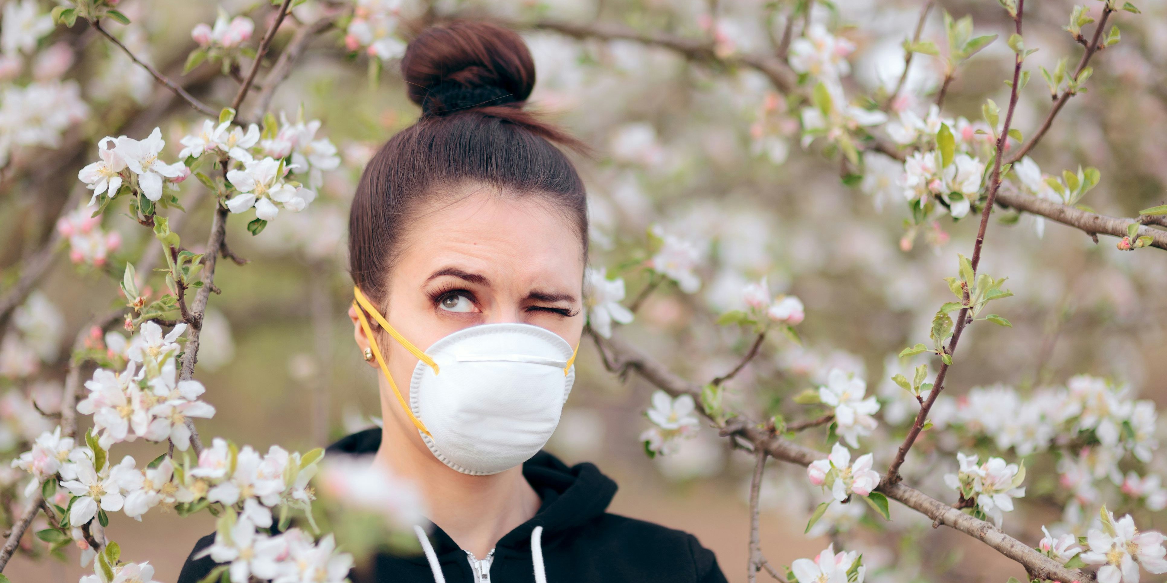 Funny girl trying to protect herself from pollen and allergens