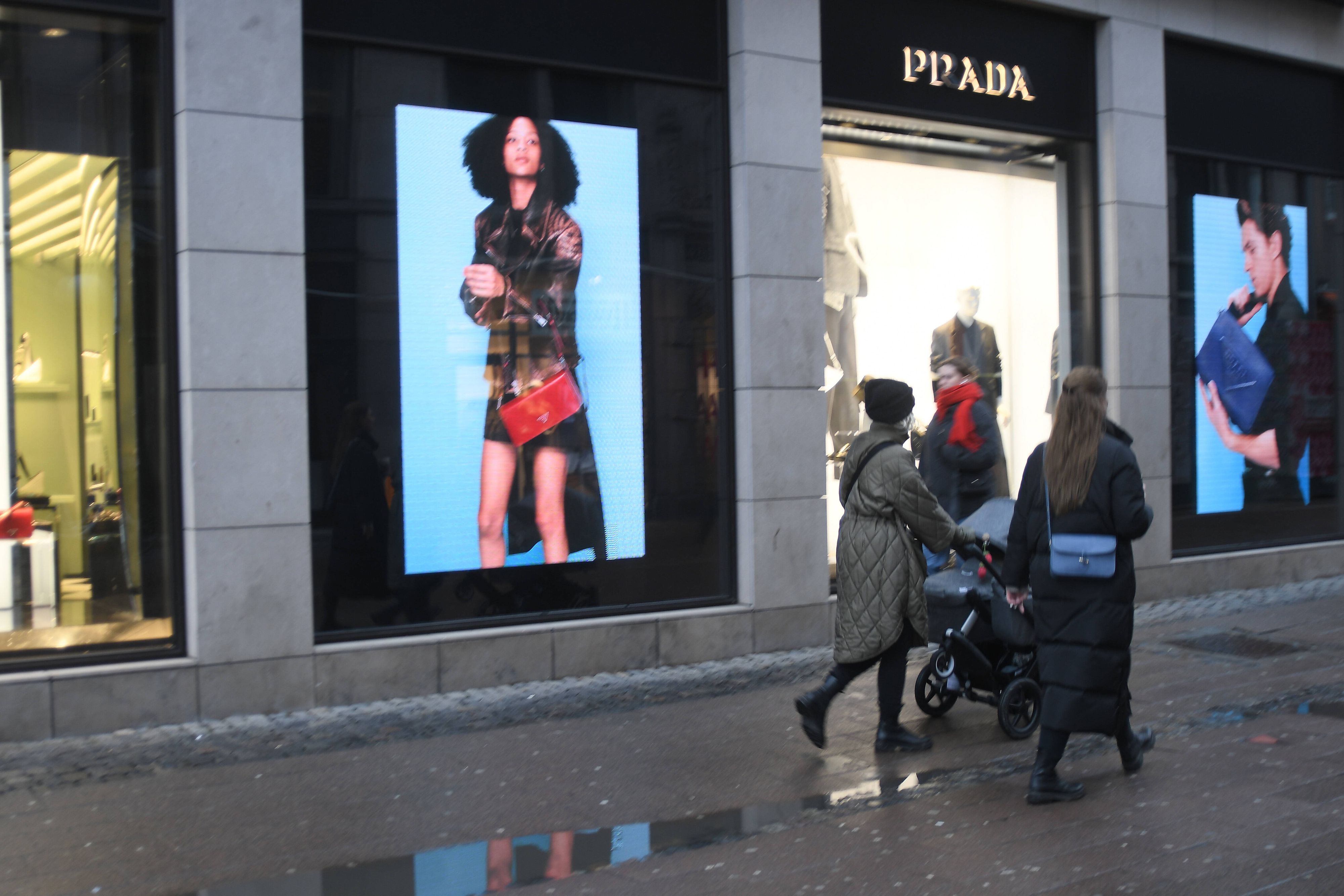 Copenhagen/Denmark./26 January 2022/. Visitors and shoppers pass by Prada store on stroeget in danish capital Copenhagen Denmark. Photo..Francis Dean/Dean Pictures 