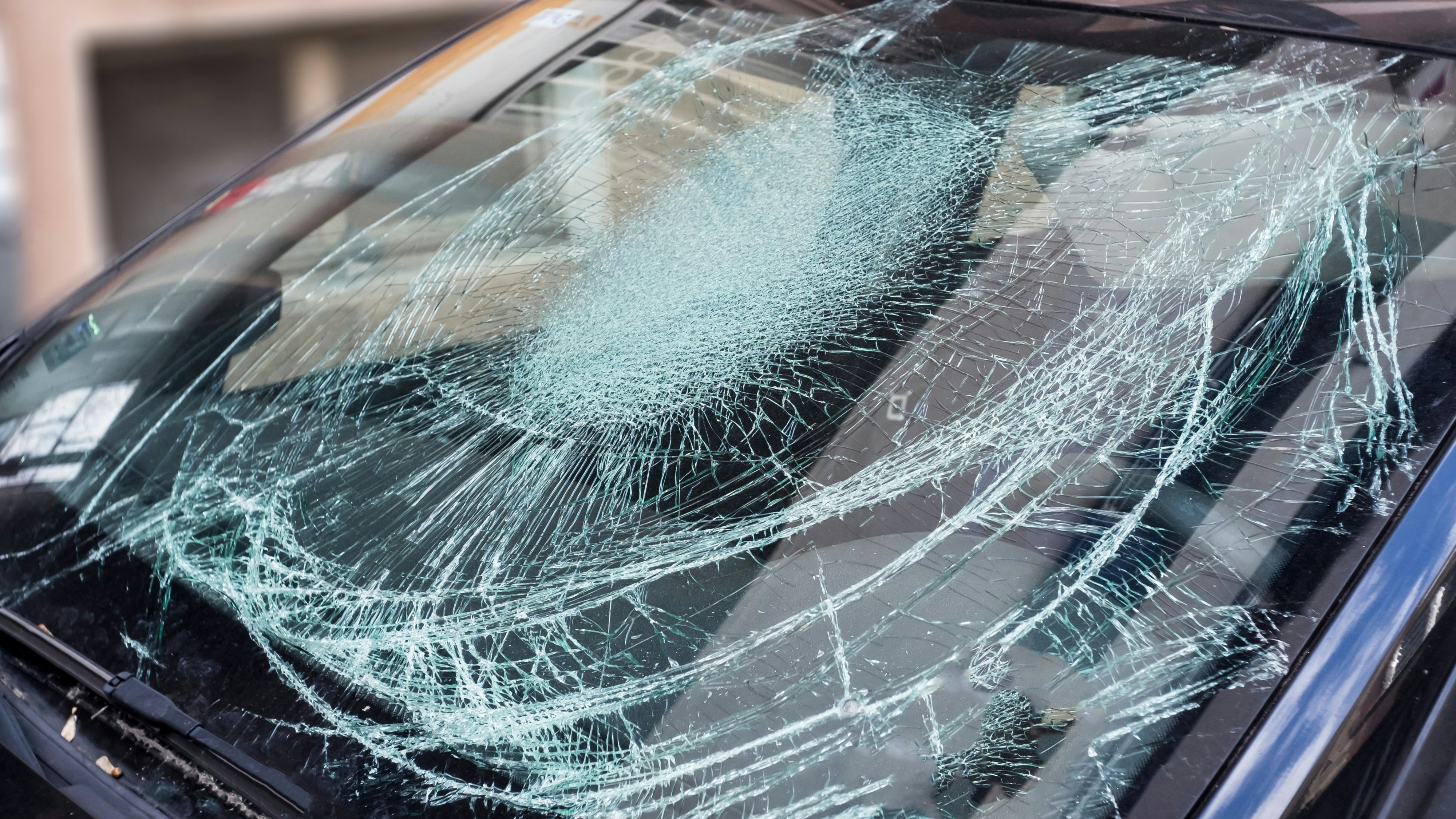 Broken car window, an accident on the road.