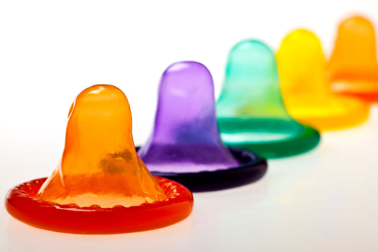 Colorful condoms lined up ready for action.
