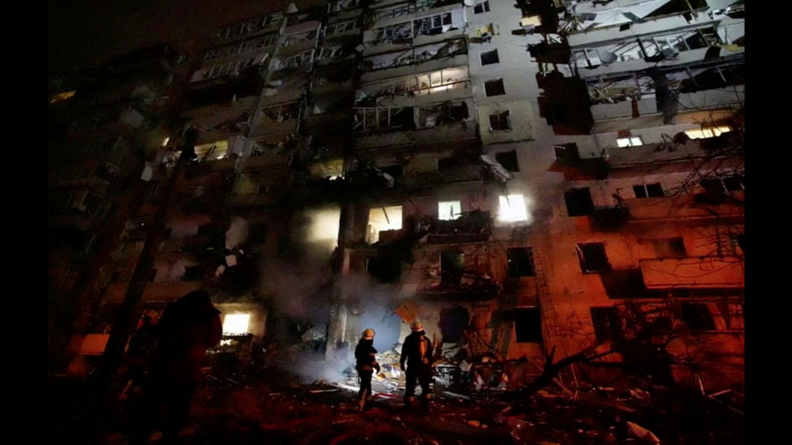 Firefighters work at the site of a damaged residential building, after Russia launched a massive military operation against Ukraine, in Kyiv, Ukraine, February 25, 2022 in this frame grab of a still image use in a video.  Ukrainian Ministry of Emergencies/via Reuters TV/Handout via REUTERS   ATTENTION EDITORS - THIS IMAGE HAS BEEN SUPPLIED BY A THIRD PARTY. NO RESALES. NO ARCHIVES