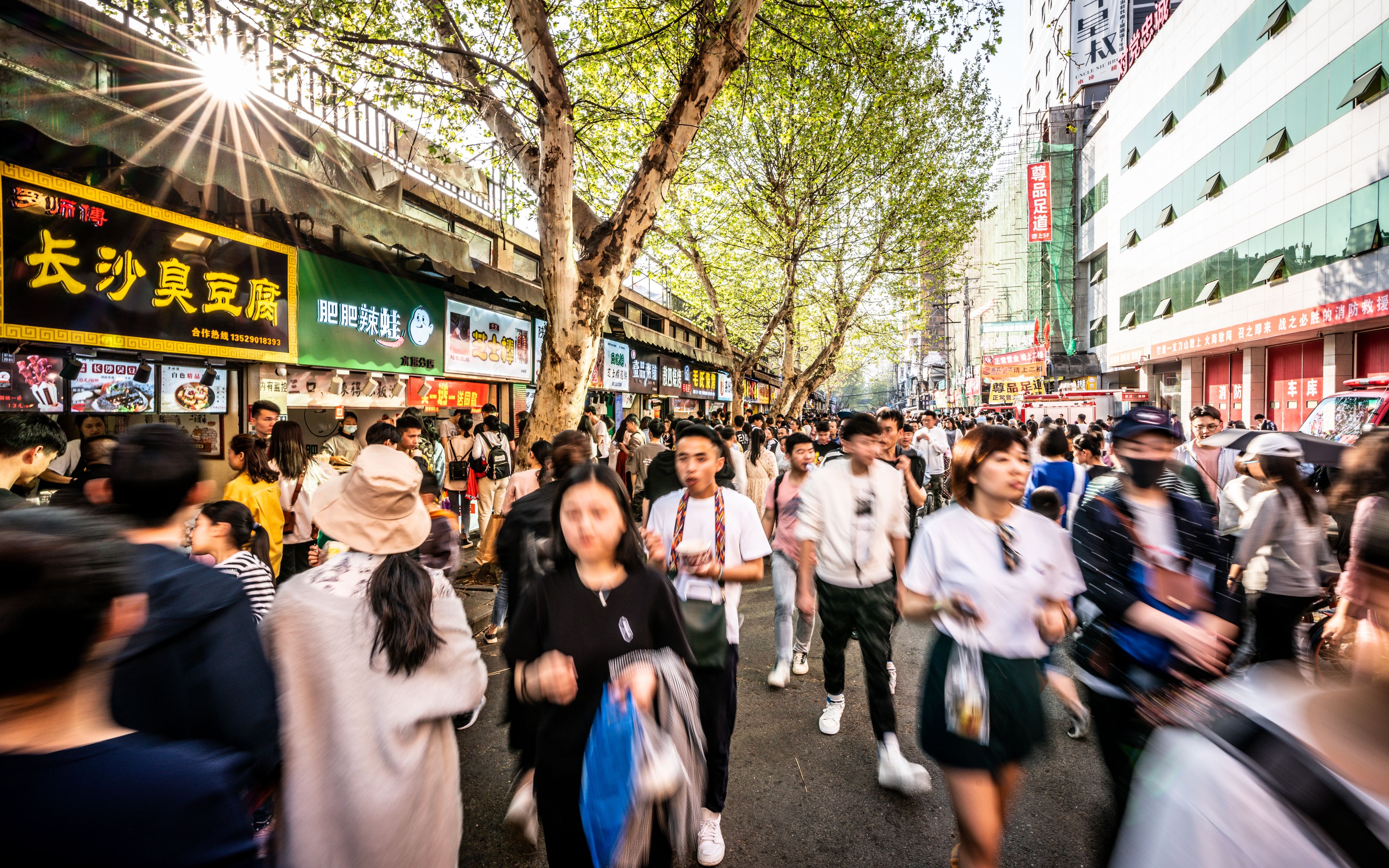 6 April 2019, Wuhan Hubei China : Moving forwad crowd of Chinese people in streetfood street in Wuhan Hubei China