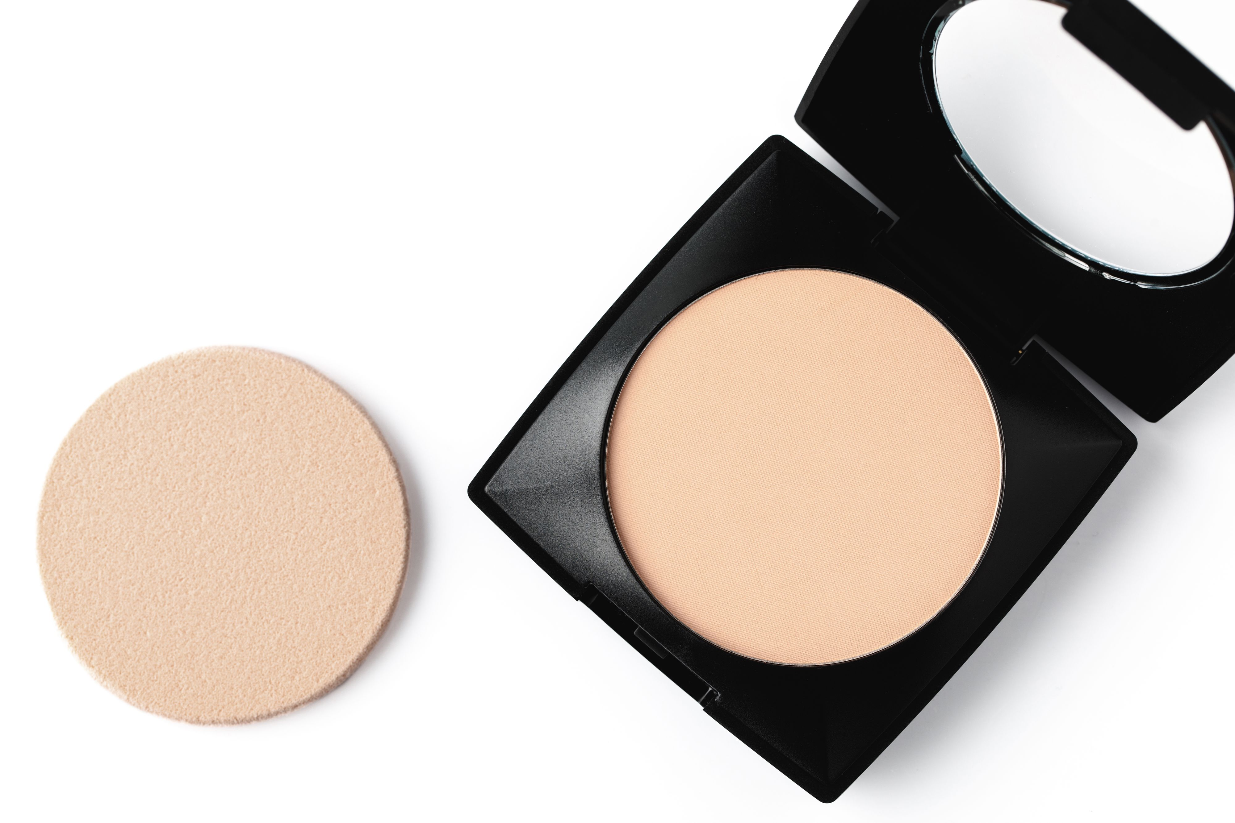 top view of compact powder and sponge isolated on white