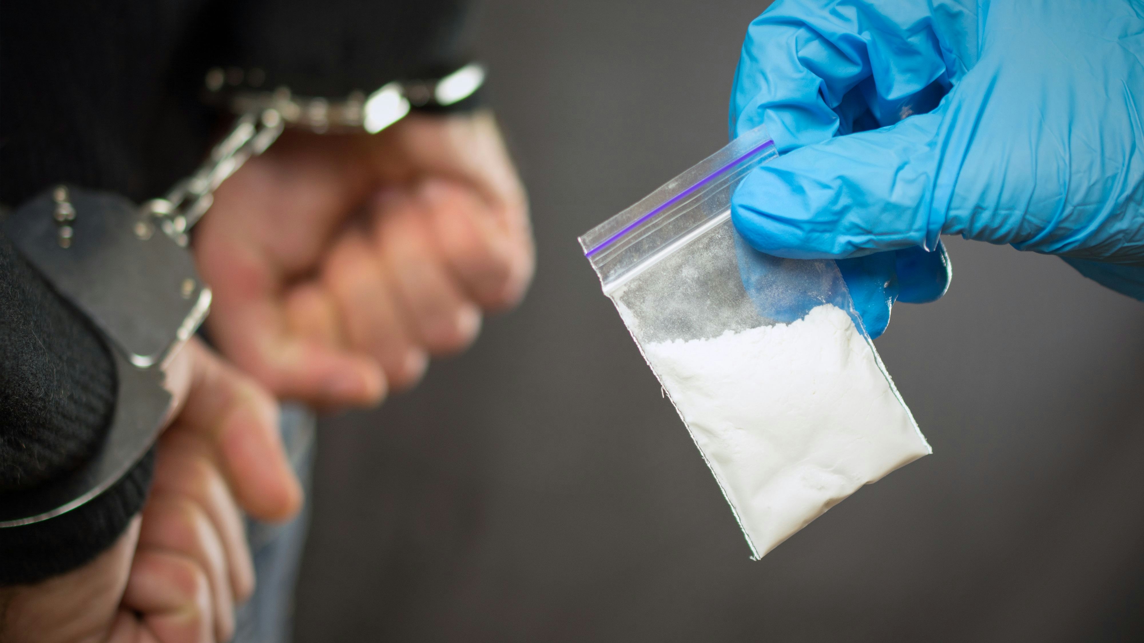 A police officer finds drugs during the search of drug dealers