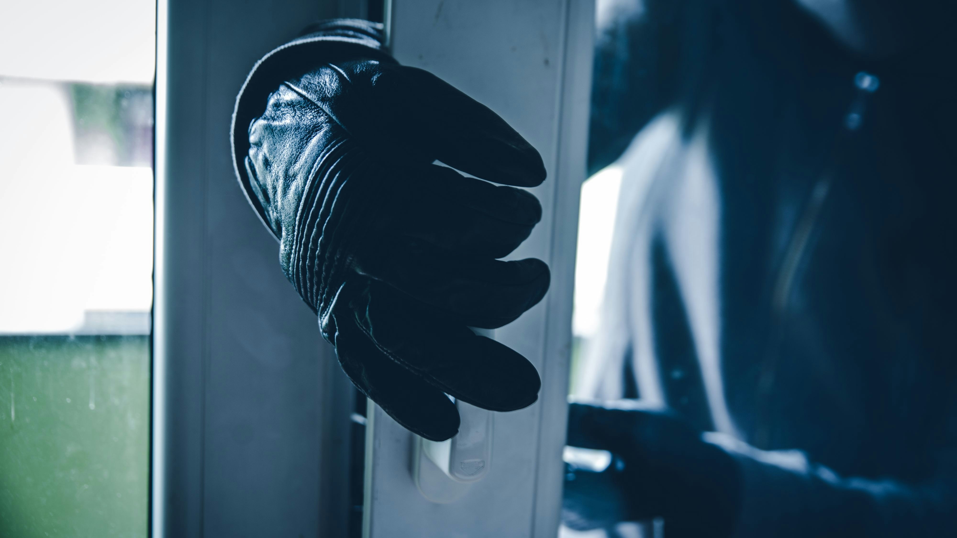 Burglar Breaking Into House