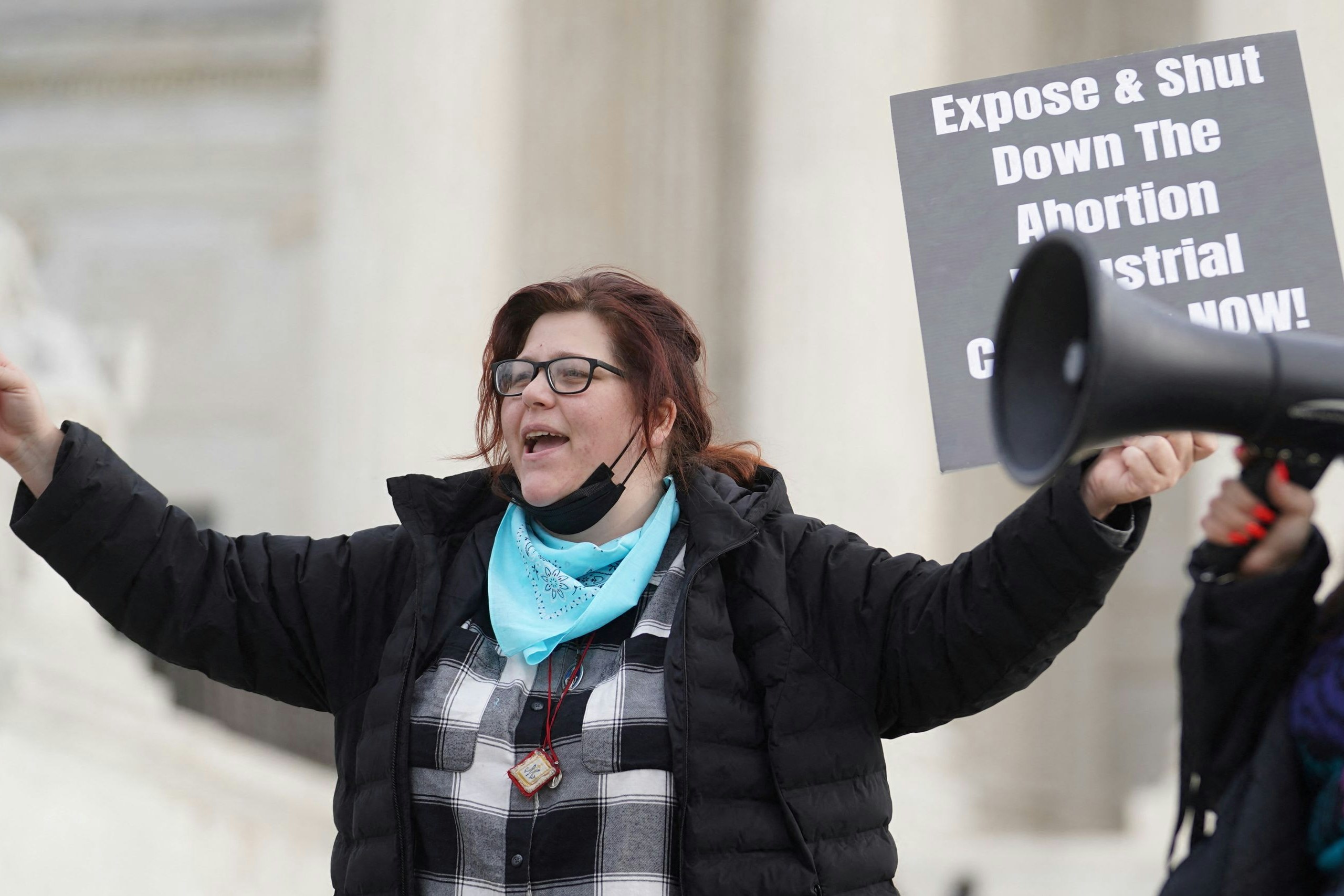 FILE PHOTO: Anti-abortion activists Lauren handy and Terrisa Bukovinac chant slogans after justices allowed abortion providers to pursue a legal challenge to a ban on most abortions in Texas, outside the U.S. Supreme Court in Washington, U.S., December 10, 2021. REUTERS/Sarah Silbiger/File Photo