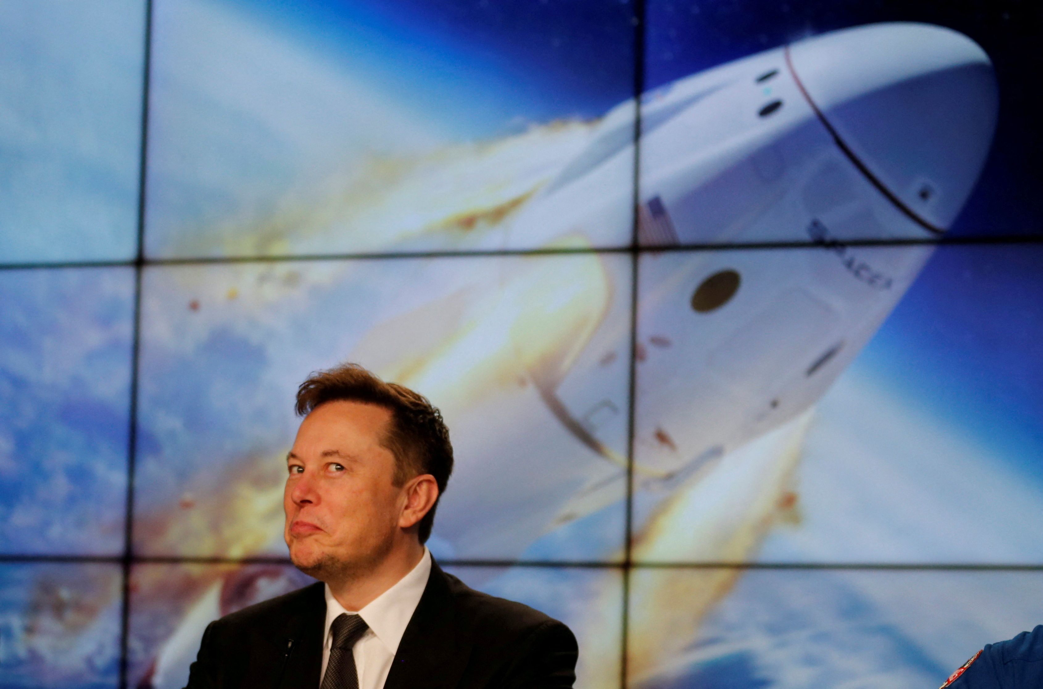 FILE PHOTO: SpaceX founder and chief engineer Elon Musk reacts during a post-launch news conference to discuss the SpaceX Crew Dragon astronaut capsule in-flight abort test at the Kennedy Space Center in Cape Canaveral, Florida, U.S. January 19, 2020. REUTERS/Joe Skipper/File Photo