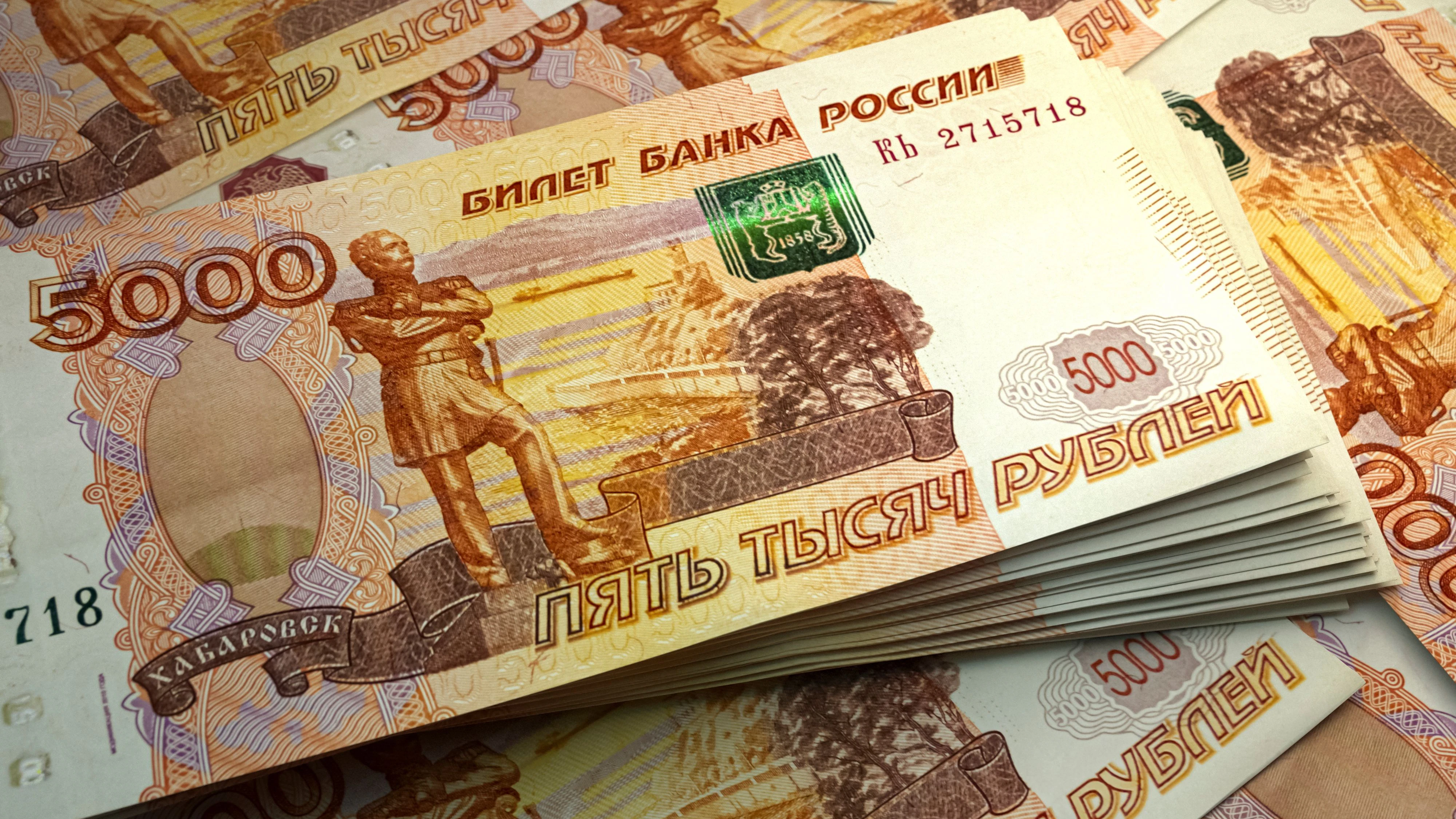 Money of Russia. Russian ruble bills. RUB banknotes. 5000 rubles. Business, finance, news background.