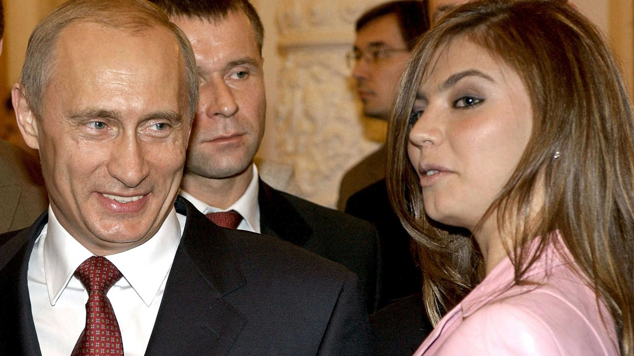 Russian President Vladimir Putin (L) smiles next to Russian gymnast Alina Kabaeva during a meeting with the Russian Olympic team at the Kremlin in Moscow, Russia in this November 4, 2004 file photo. REUTERS/ITAR-TASS/PRESIDENTIAL PRESS SERVICE/Files      TPX IMAGES OF THE DAY