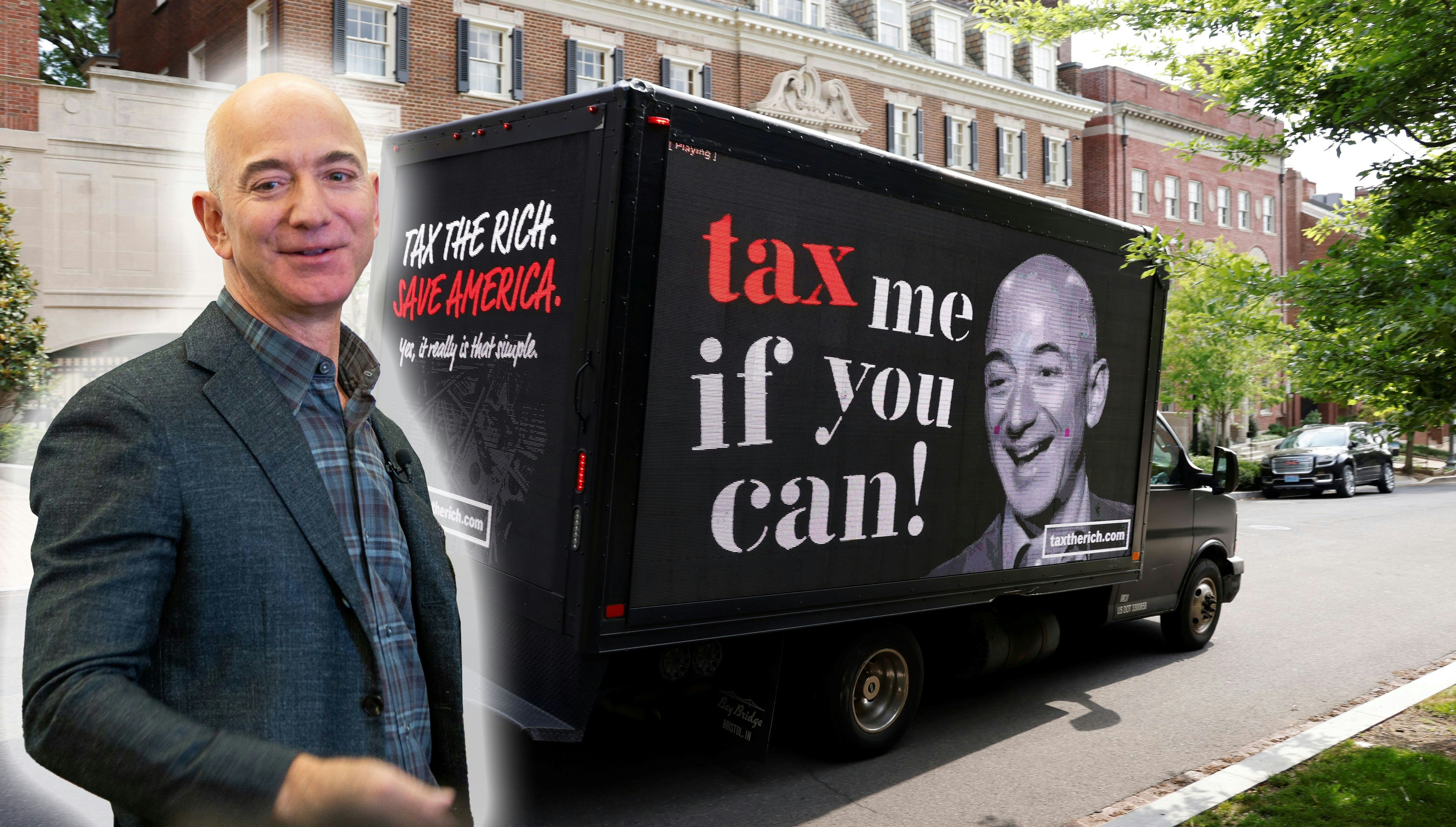 A video protest sign on a truck paid for by the Patriotic Millionaires drives past a mansion owned by Amazon founder Jeff Bezos as part of a federal tax filing day protest to demand he pay his fair share of taxes, in Washington, U.S. May 17, 2021.  REUTERS/Jonathan Ernst