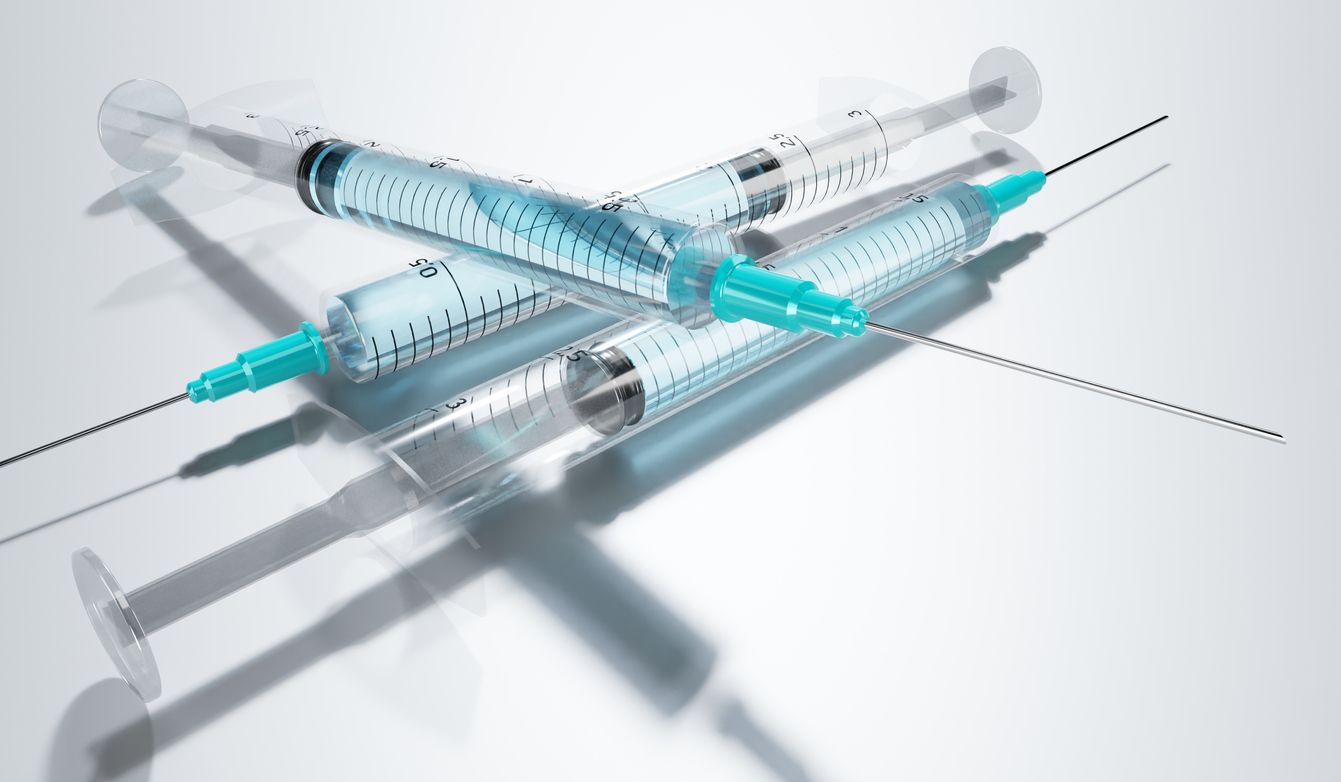 Three syringes with vaccine/ medication isolated on grey background - 3D illustration