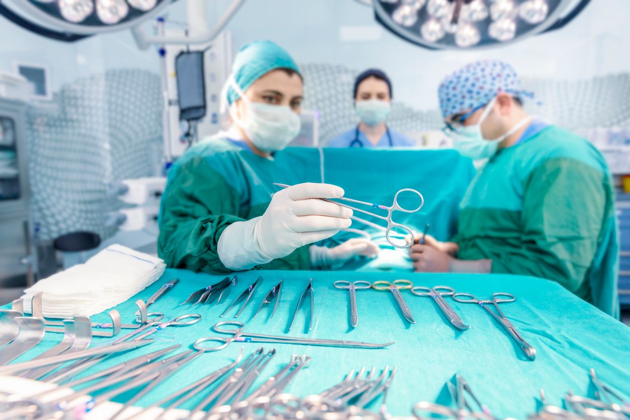 Surgeons in full surgical gear during operation