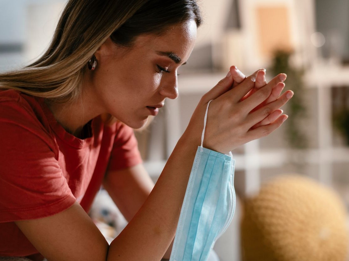 Young woman waiting results from the laboratory. Worried woman waiting Covid-19 test.